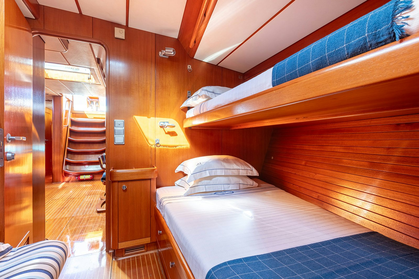 a bedroom with two bunk beds aboard DAG Yacht for Sale