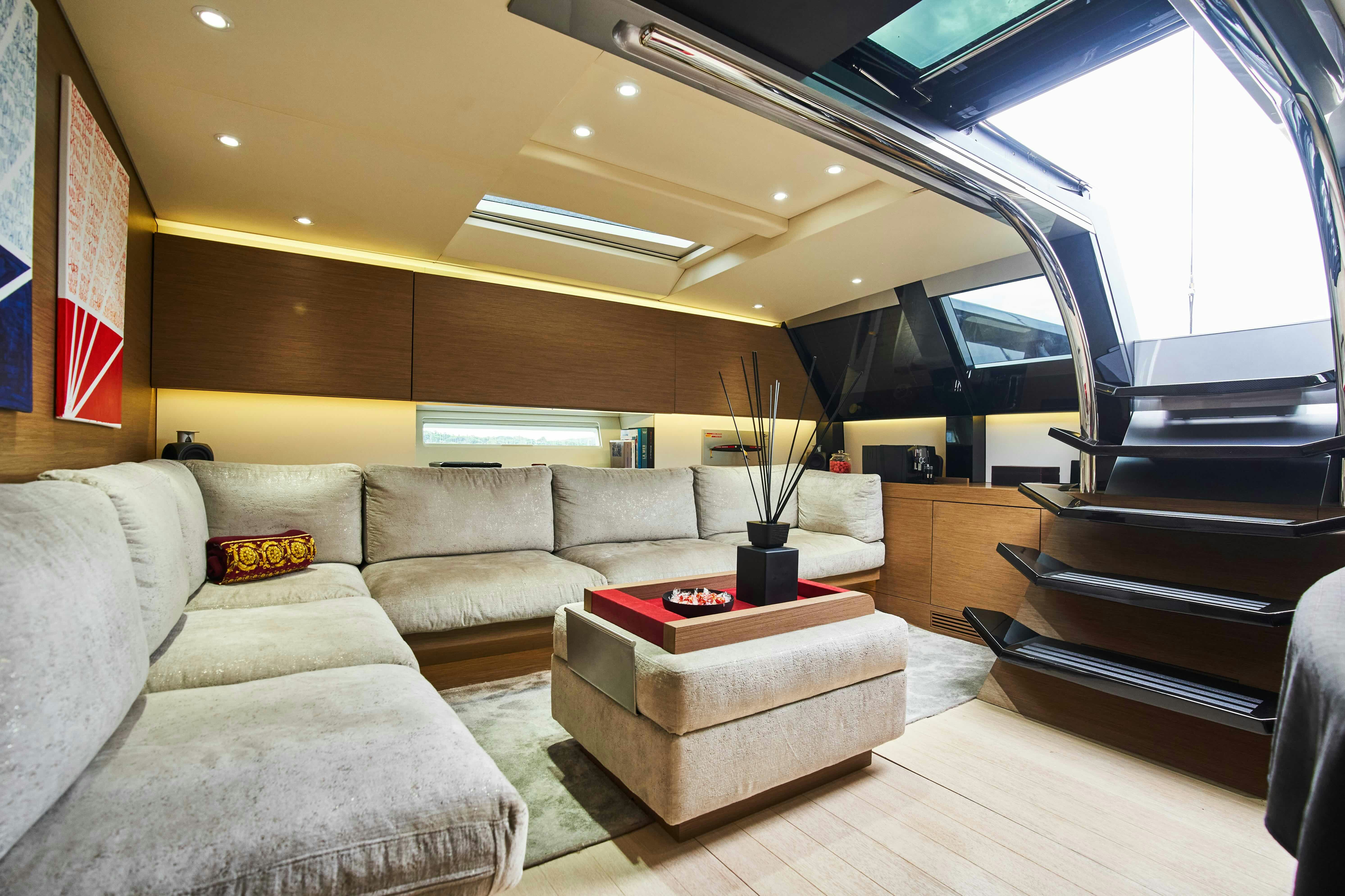a living room with a couch and a table aboard BLACK SAILS Yacht for Sale