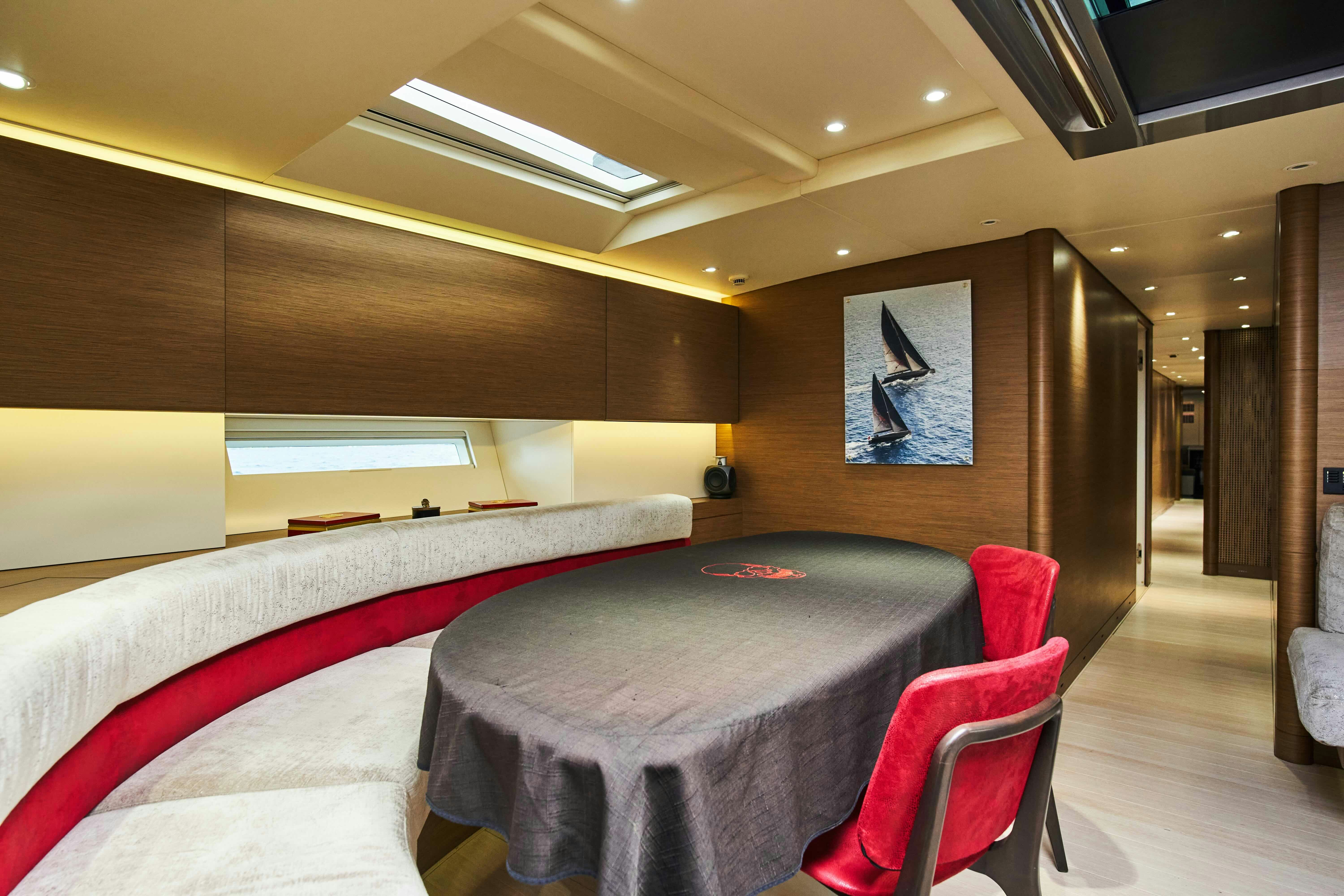 a room with a table and chairs aboard BLACK SAILS Yacht for Sale