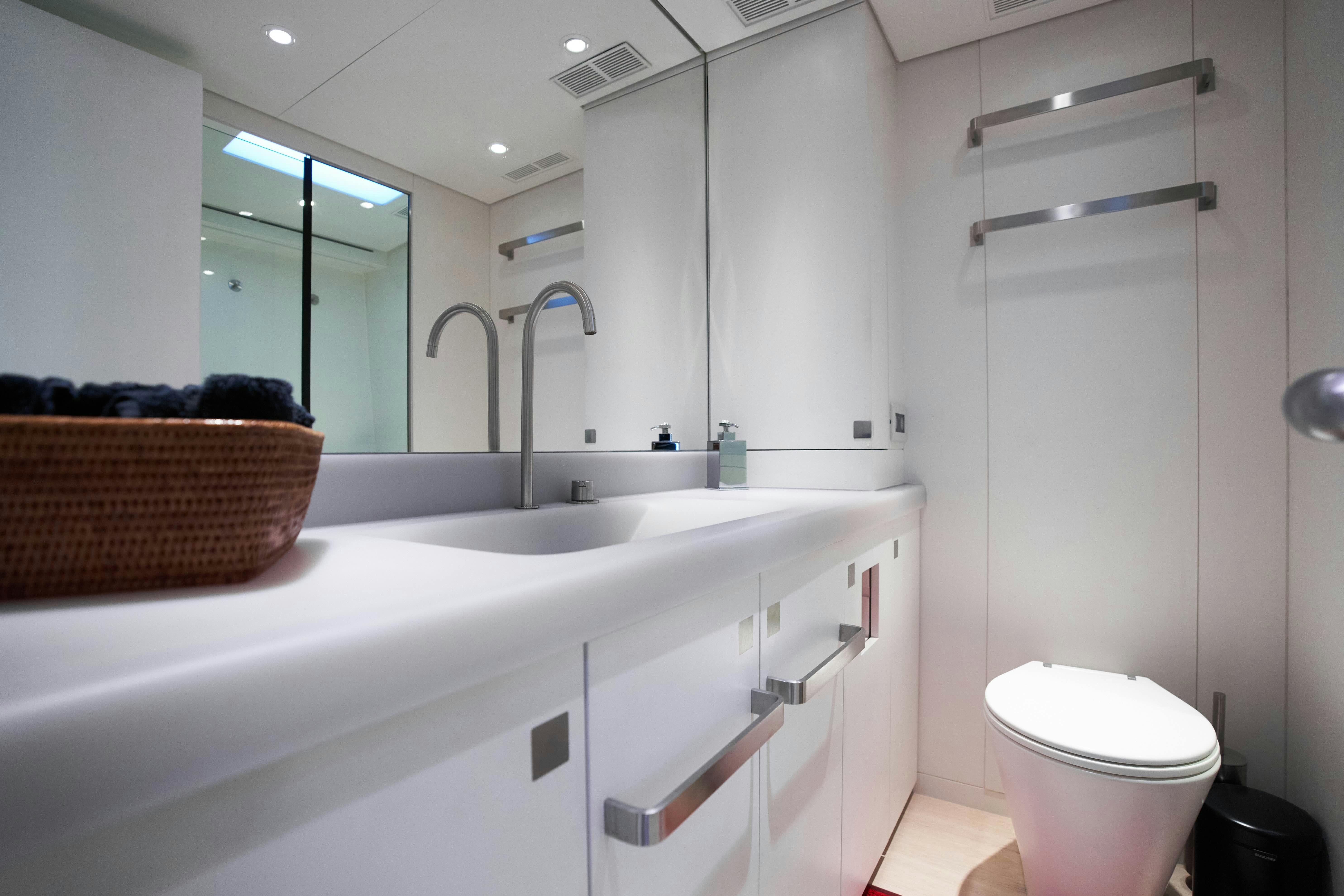 a bathroom with a sink and a toilet aboard BLACK SAILS Yacht for Sale