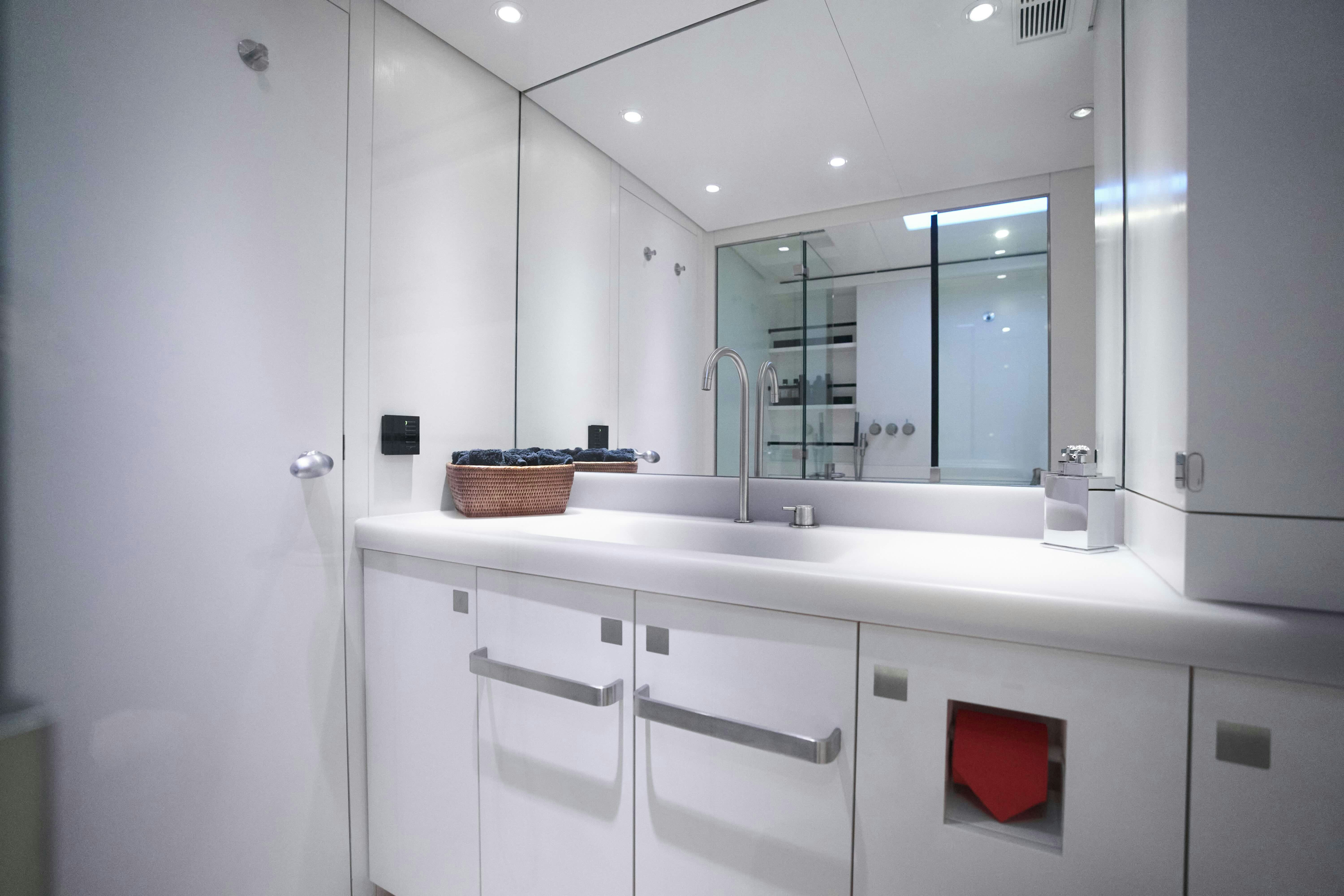 a bathroom with a sink and a mirror aboard BLACK SAILS Yacht for Sale