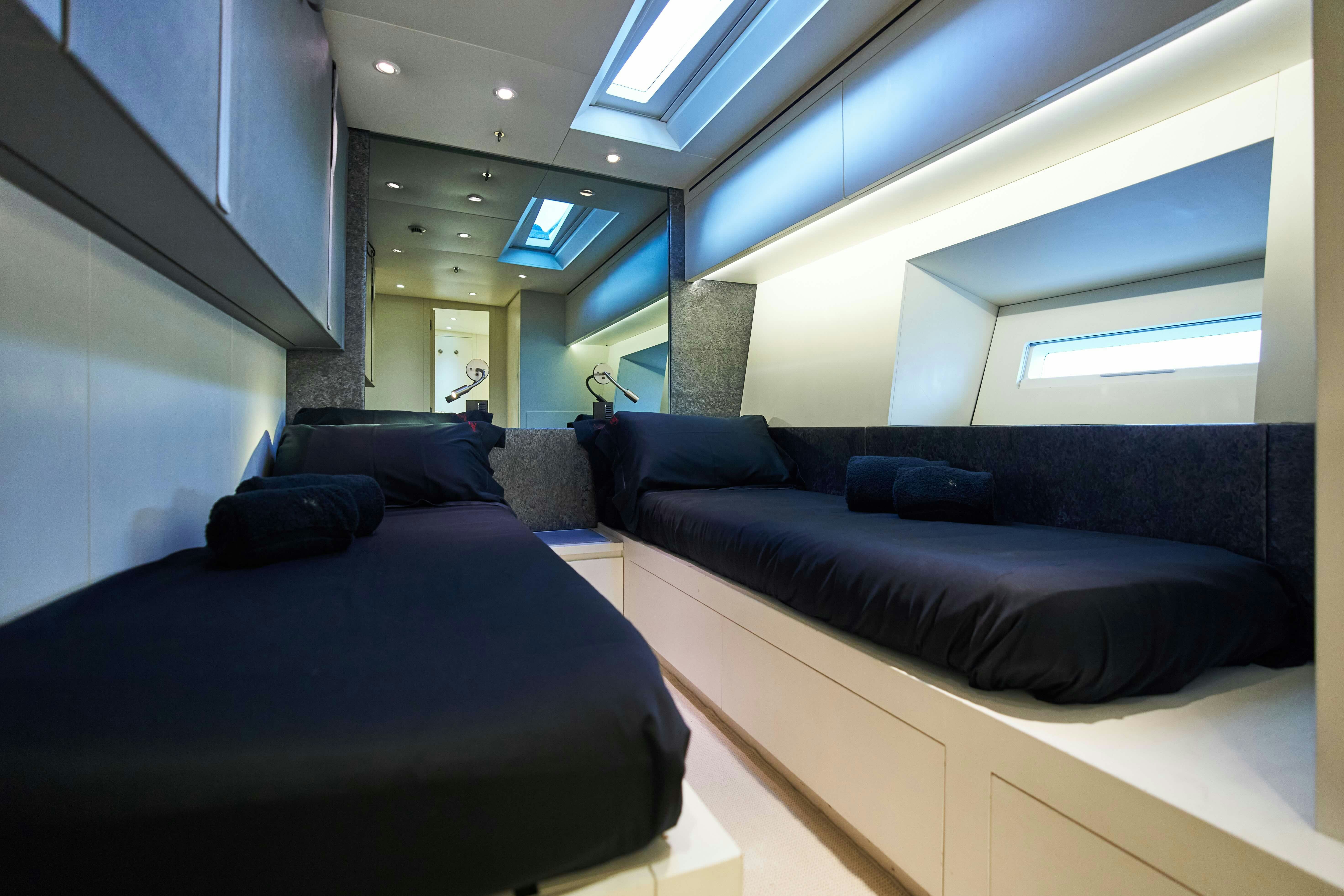 a room with a bed and a couch aboard BLACK SAILS Yacht for Sale