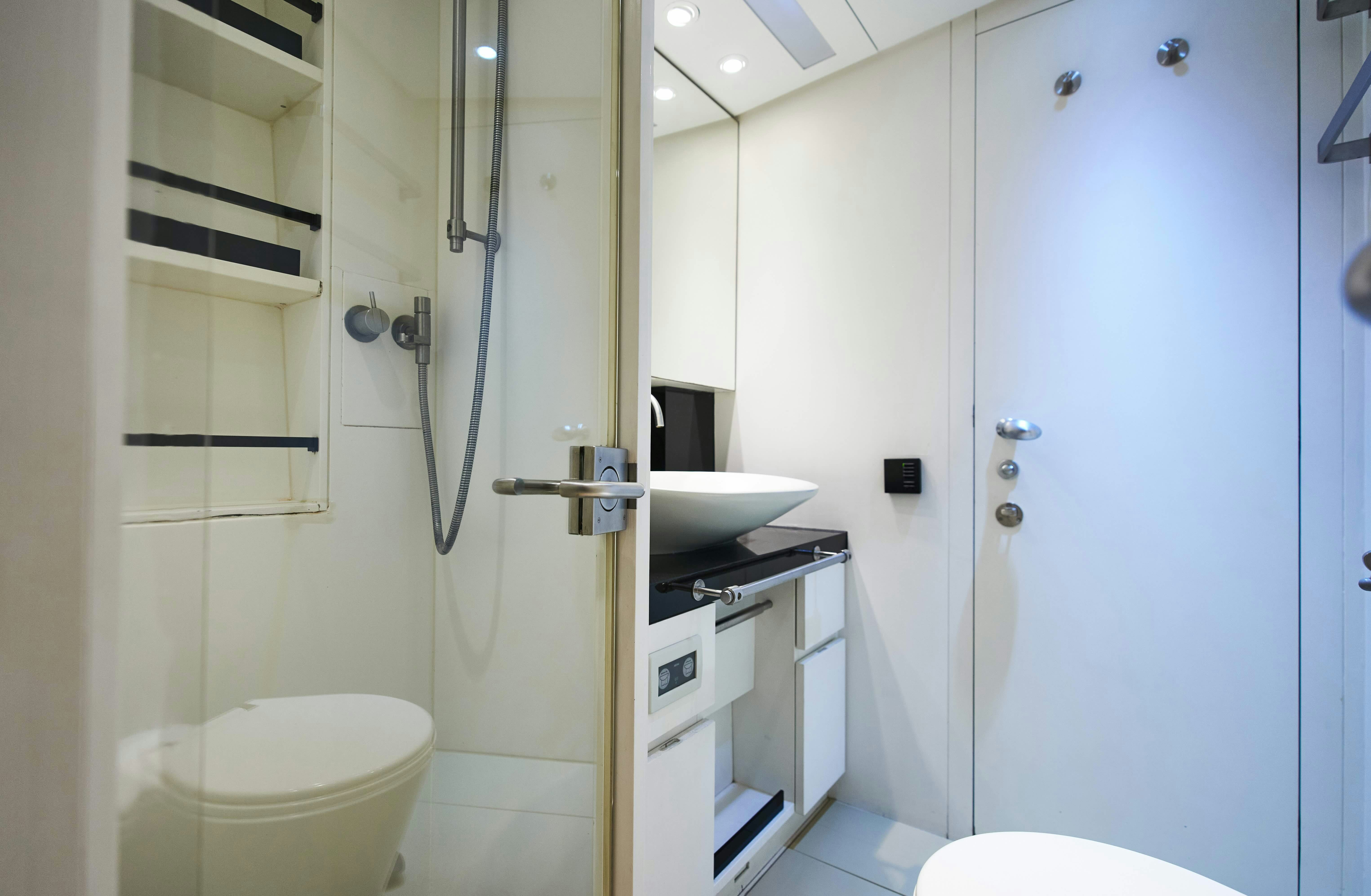 a bathroom with a sink and toilet aboard BLACK SAILS Yacht for Sale