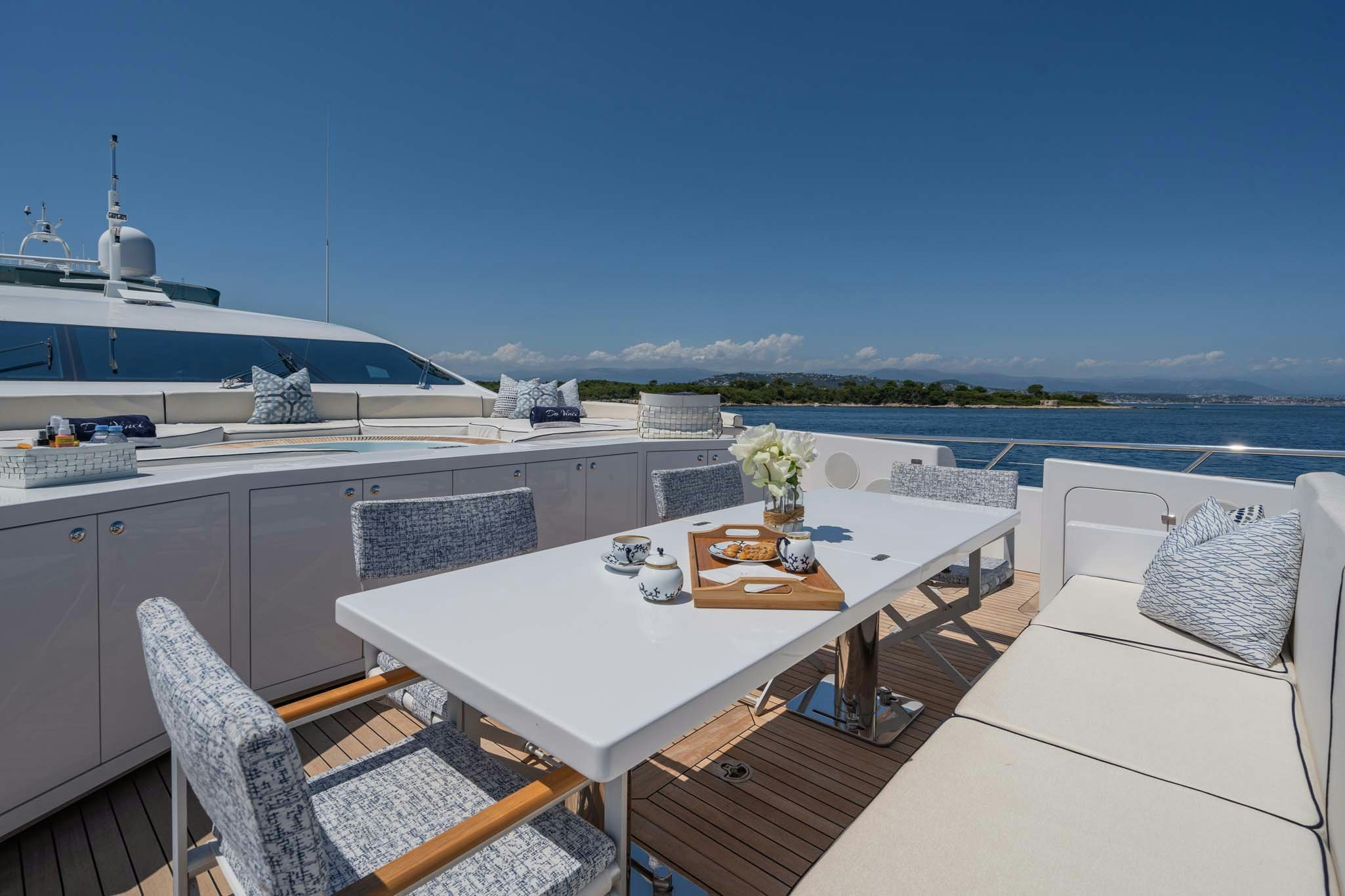 a large white table with chairs around it aboard DA VINCI Yacht for Charter