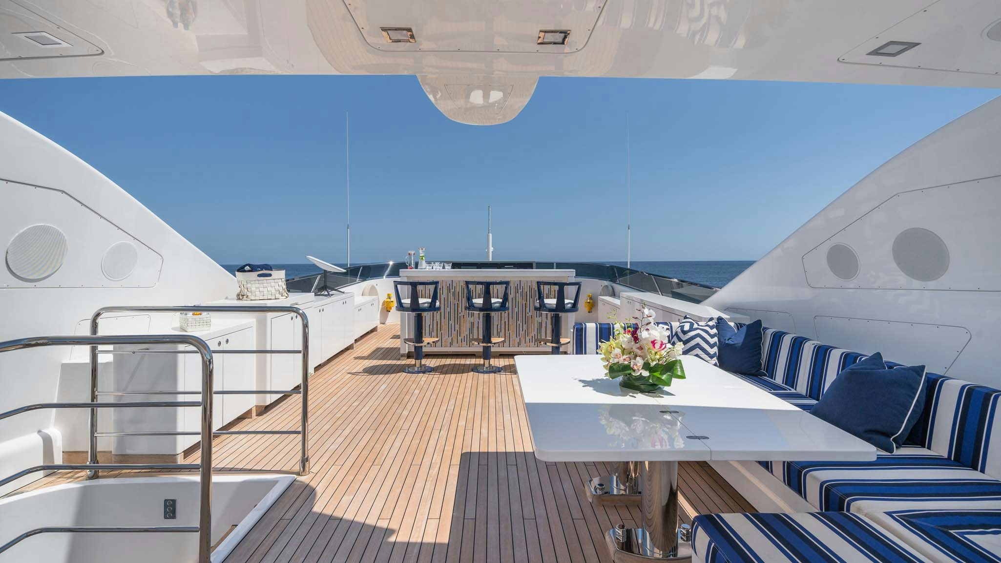 a large cruise ship with a table and chairs aboard DA VINCI Yacht for Charter