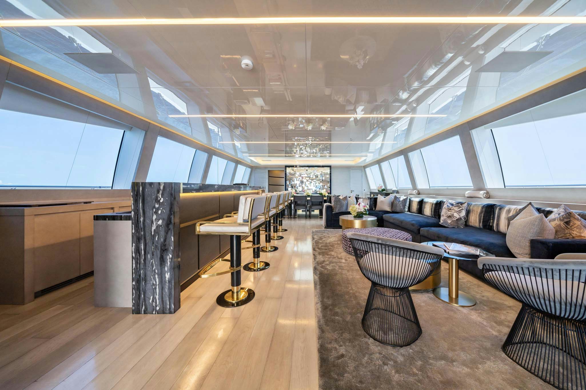 a large room with a couch and a table aboard DA VINCI Yacht for Charter