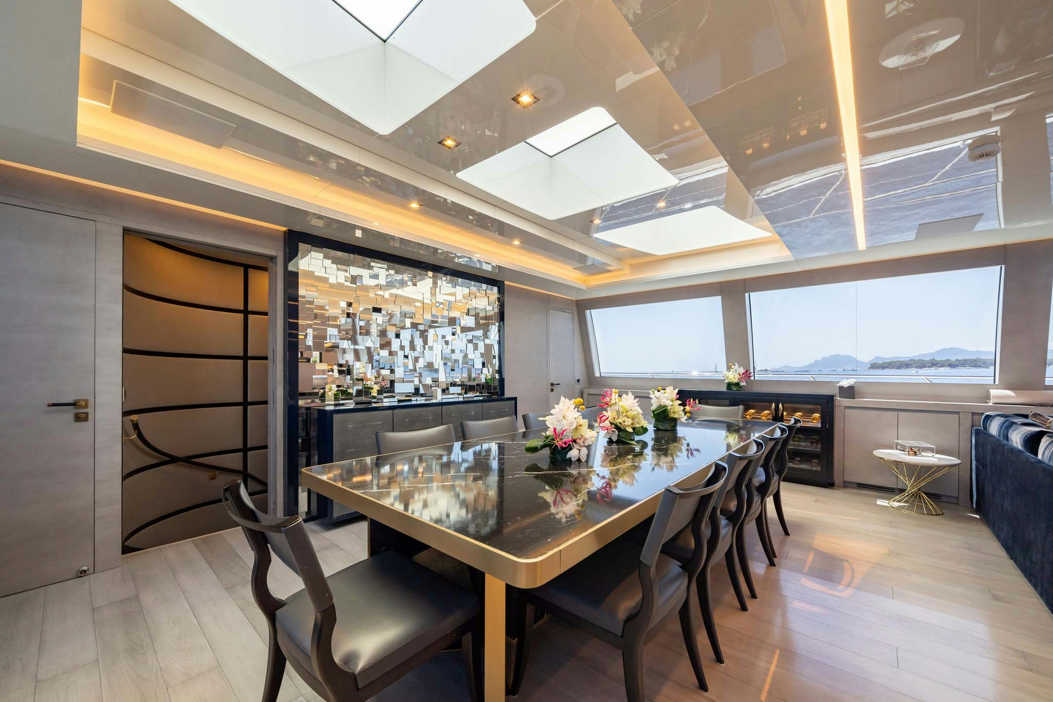 a dining room with a table aboard DA VINCI Yacht for Charter