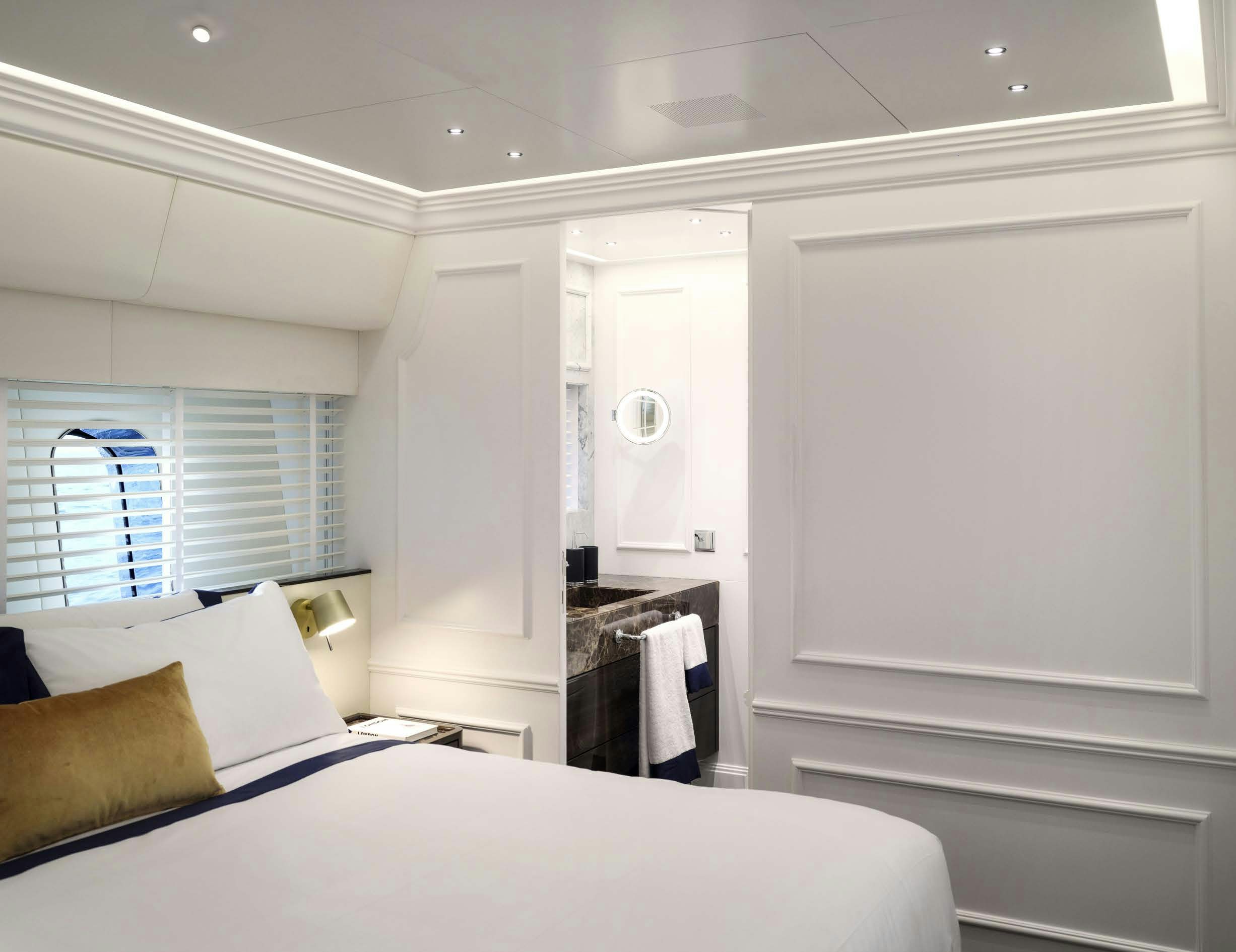 a room with a bed and a door aboard PICCHIOTTI GENTLEMAN 24M Yacht for Sale