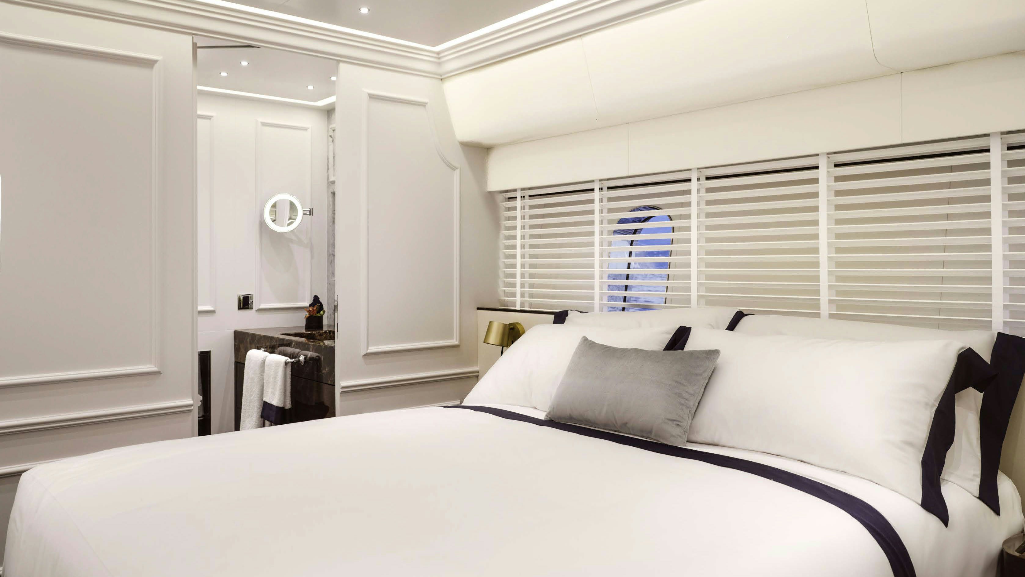 a bed with white sheets aboard PICCHIOTTI GENTLEMAN 24M Yacht for Sale