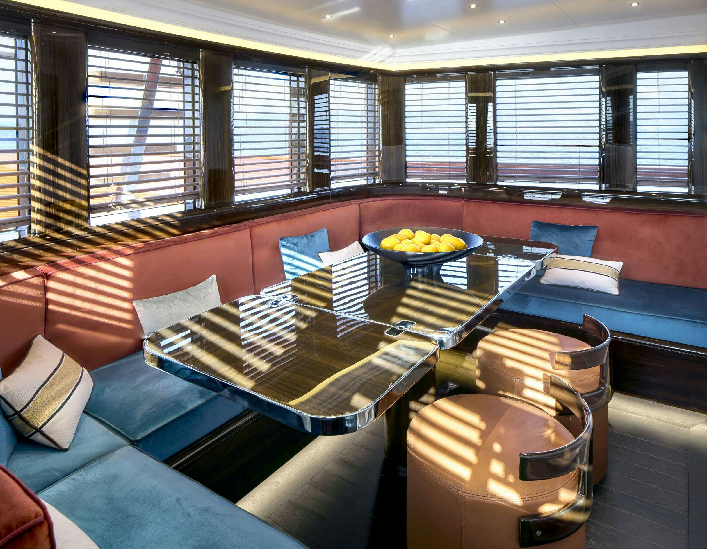 a room with a table and chairs aboard PICCHIOTTI GENTLEMAN 24M Yacht for Sale