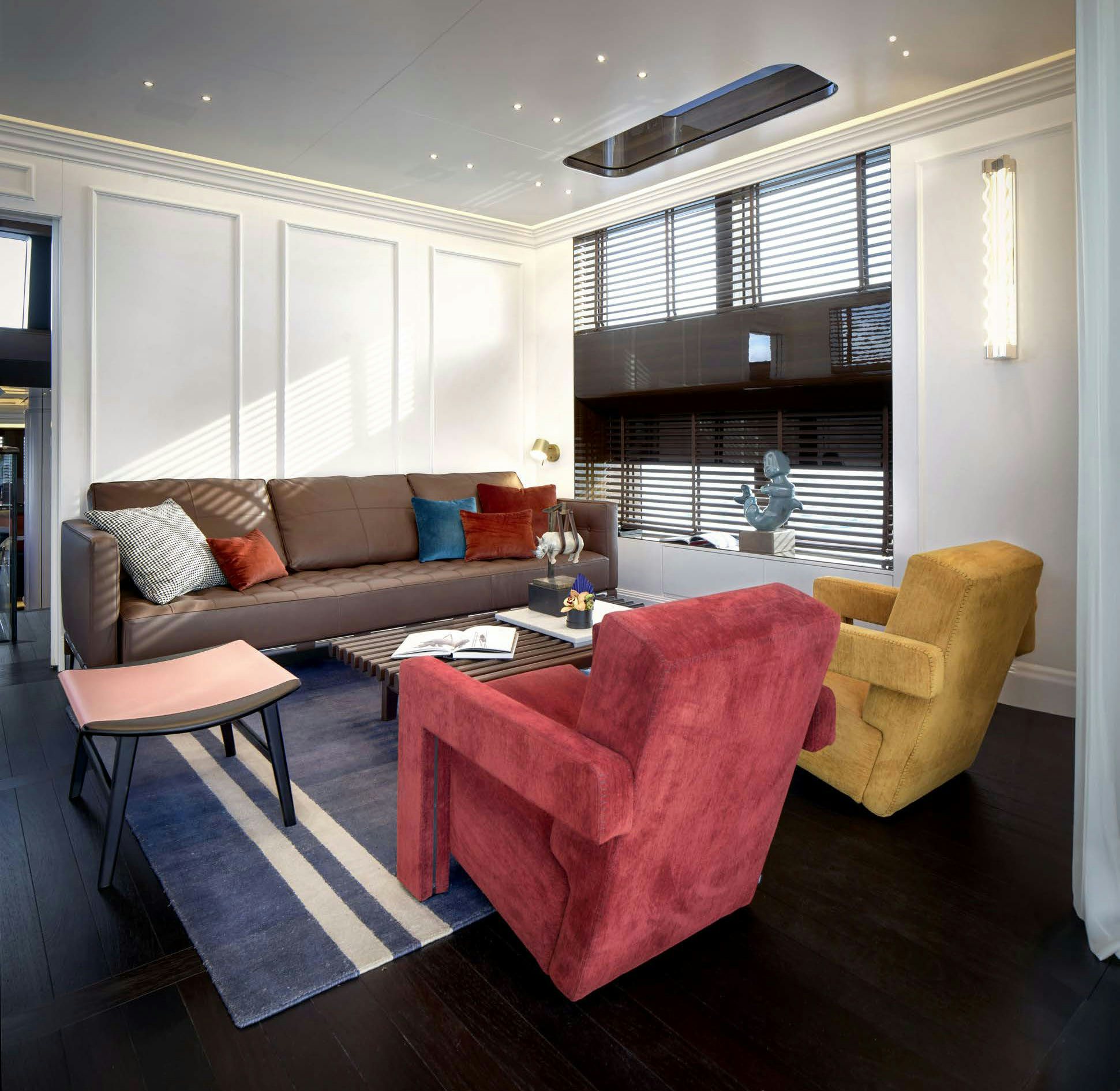 a living room with a couch and a table aboard PICCHIOTTI GENTLEMAN 24M Yacht for Sale