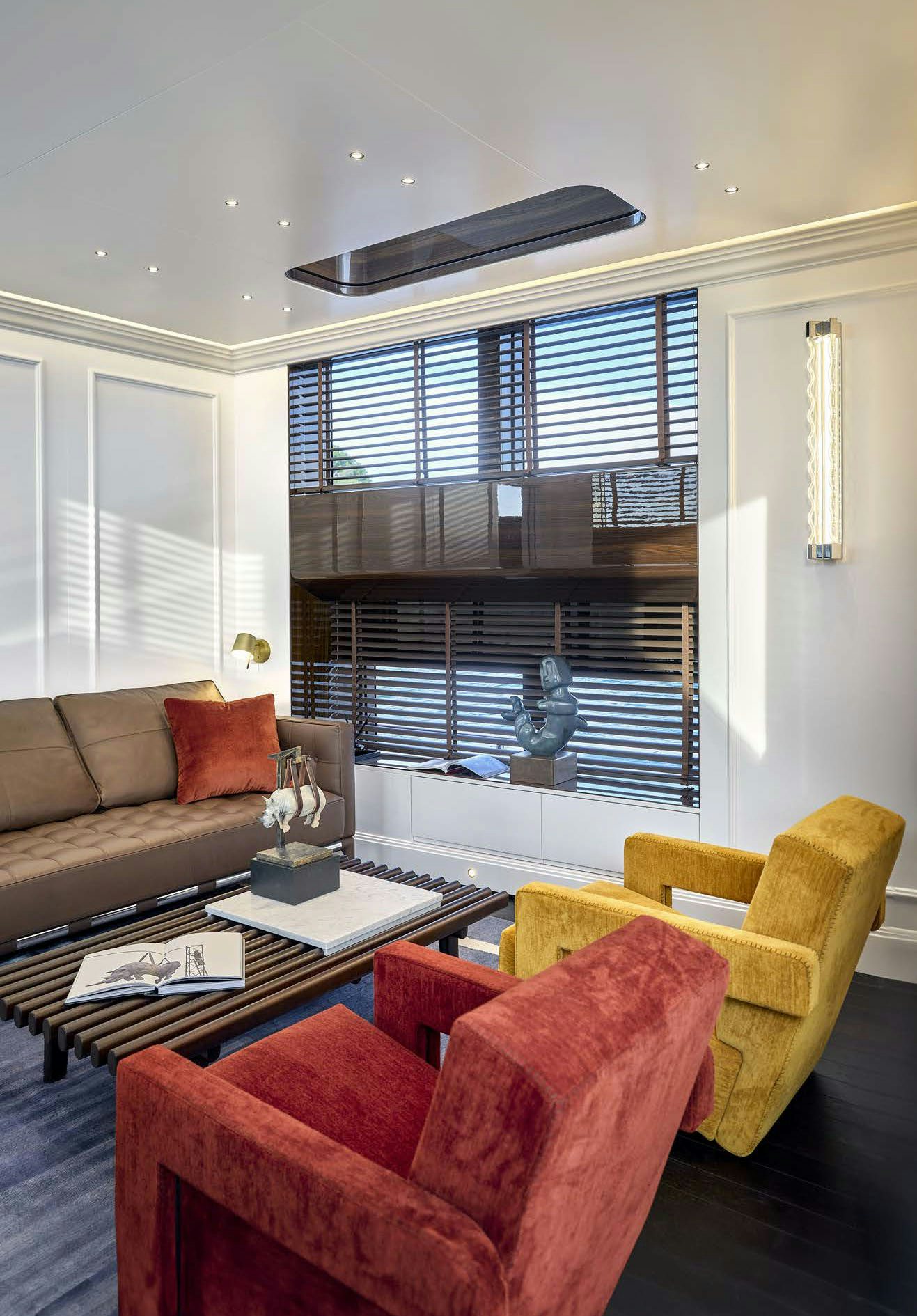 a living room with a couch and a coffee table aboard PICCHIOTTI GENTLEMAN 24M Yacht for Sale