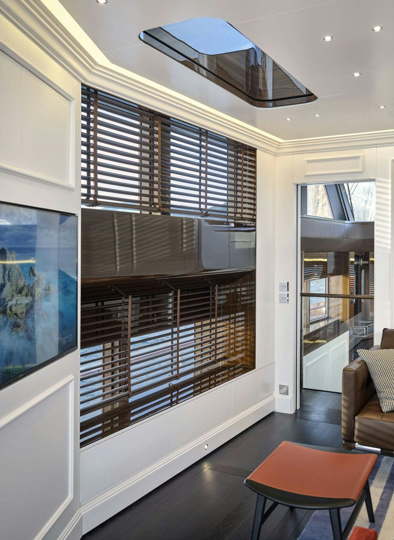 a room with a large window aboard PICCHIOTTI GENTLEMAN 24M Yacht for Sale