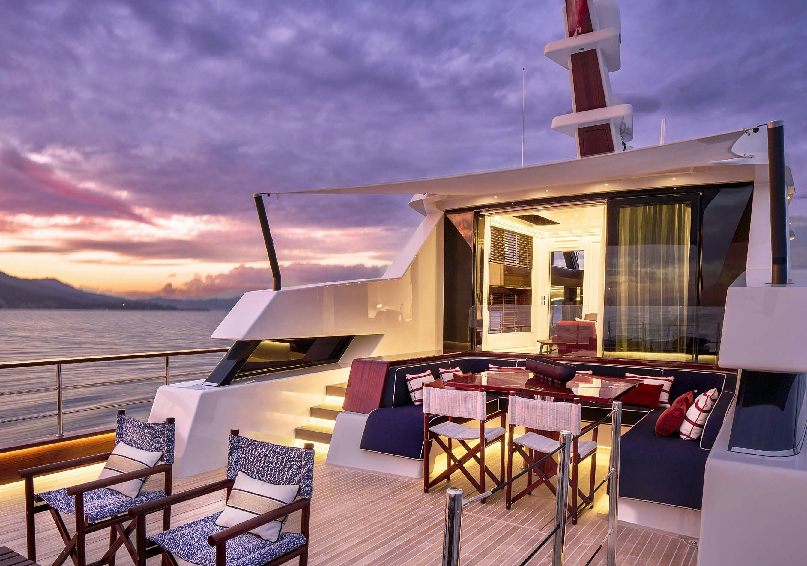 a deck with a view of the ocean and the sunset aboard PICCHIOTTI GENTLEMAN 24M Yacht for Sale