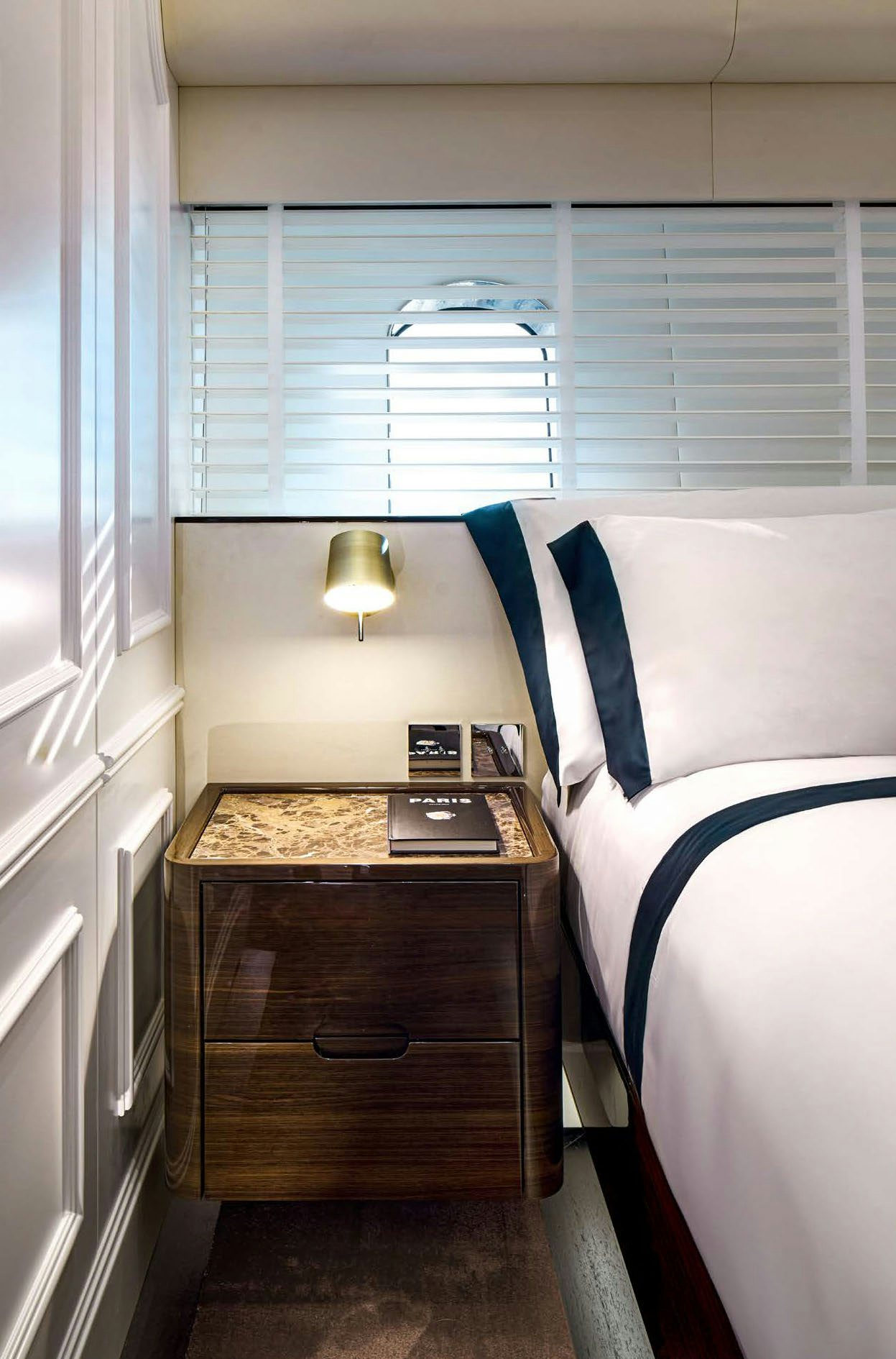 a bedroom with a bed and desk aboard PICCHIOTTI GENTLEMAN 24M Yacht for Sale