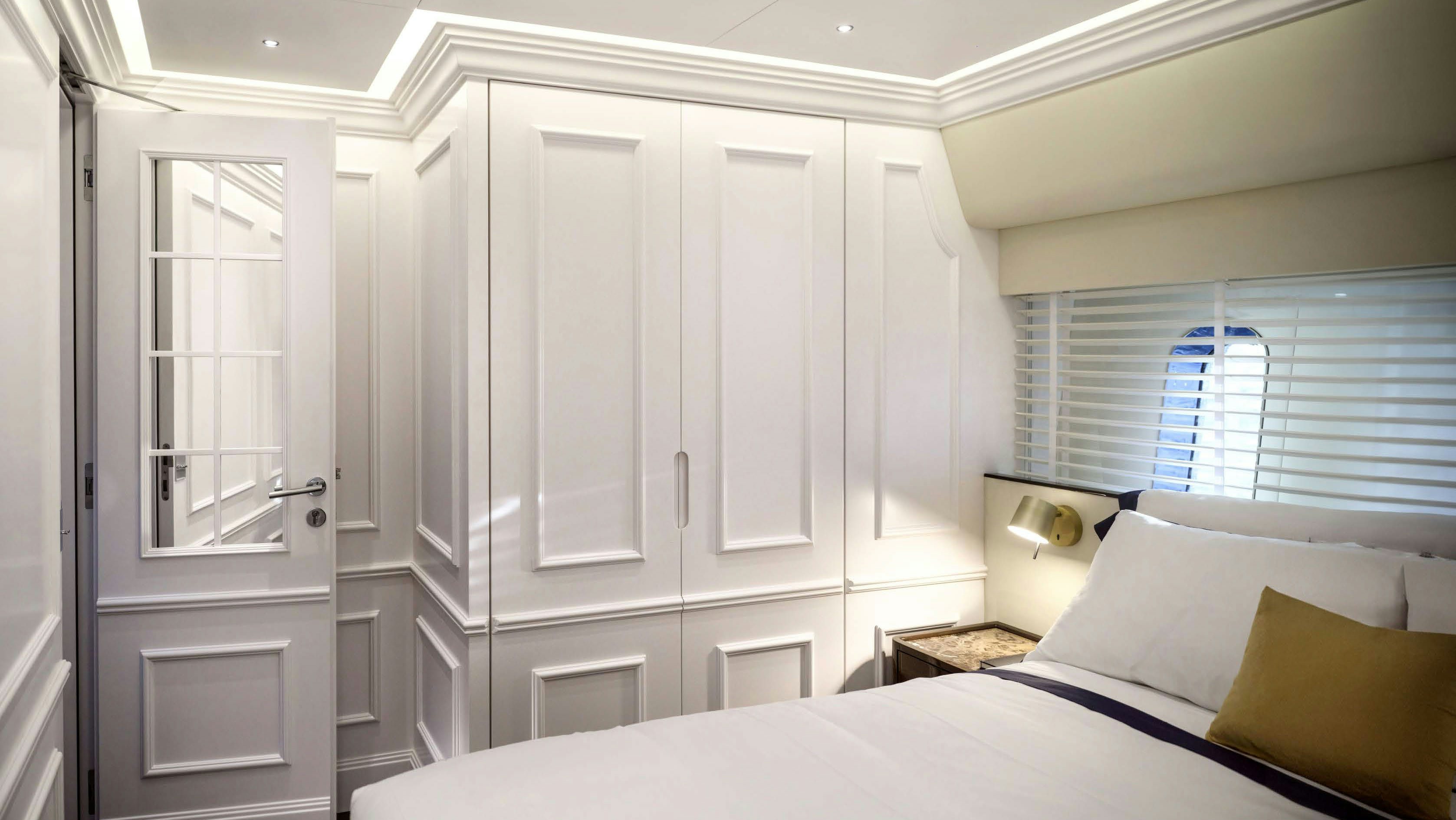 a room with a bed and a window aboard PICCHIOTTI GENTLEMAN 24M Yacht for Sale