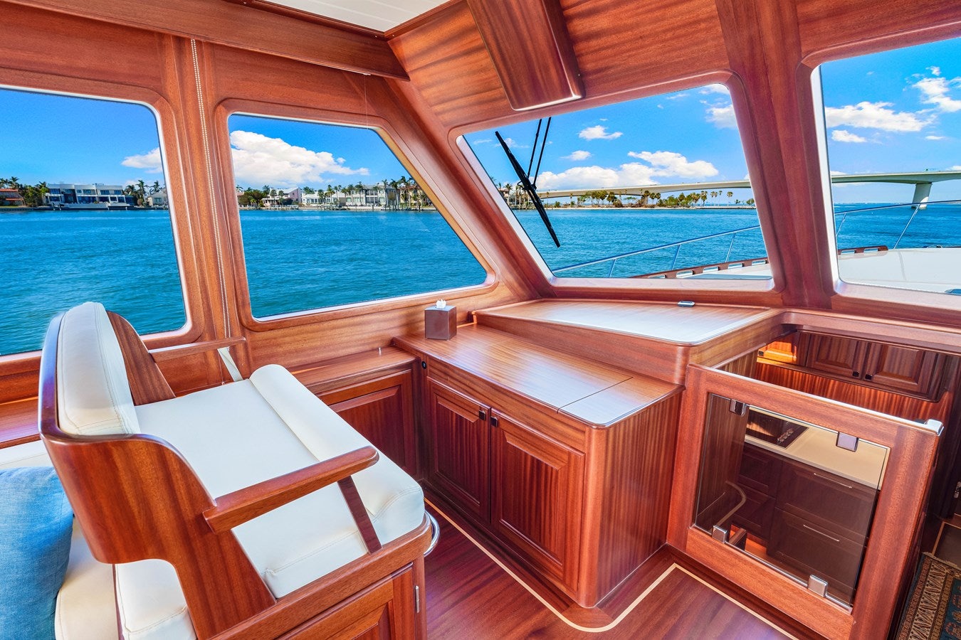 a room with a view of the ocean and a large window aboard ISLAND GIRL III Yacht for Sale