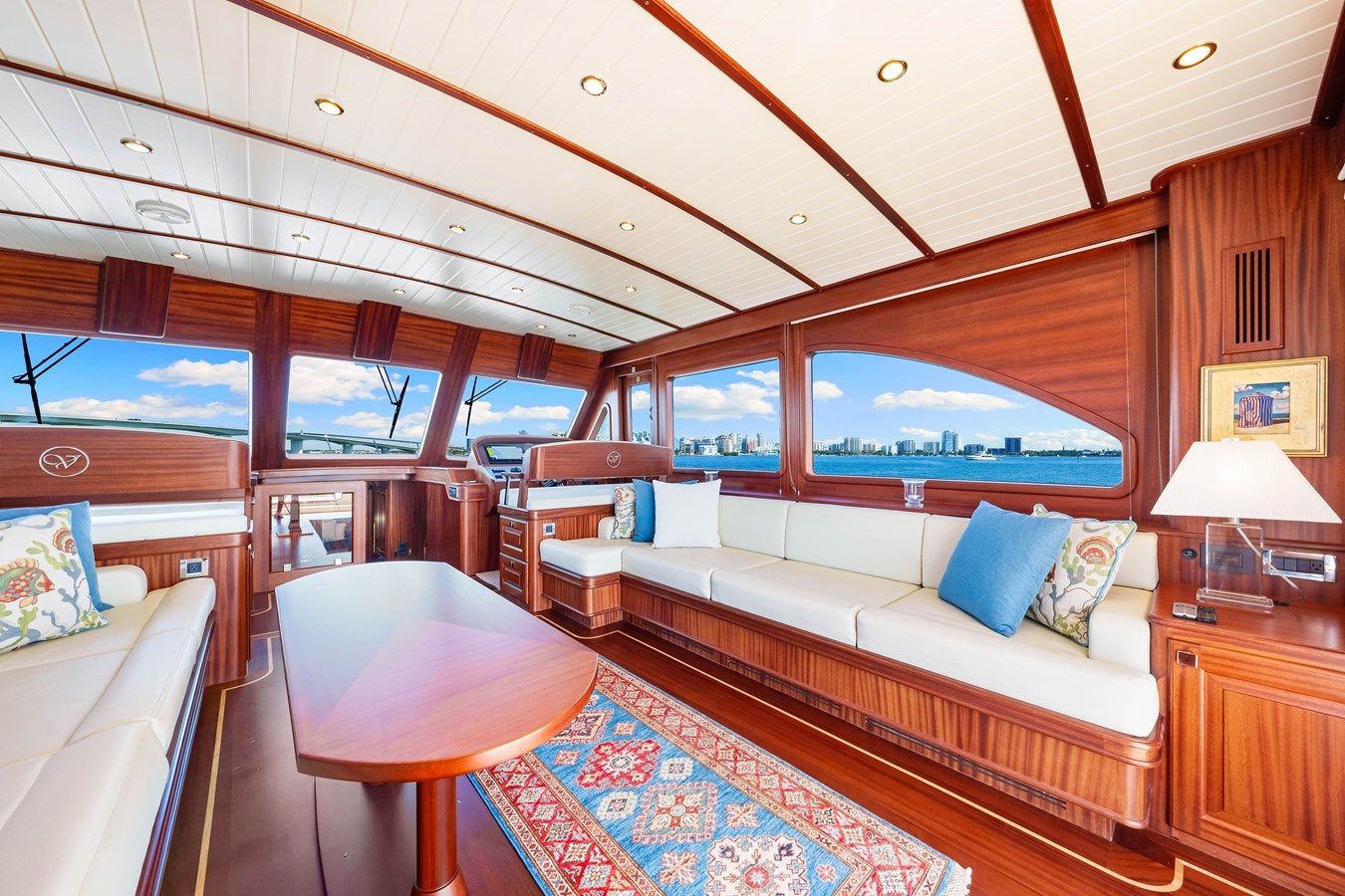 a room with a bed and a large window aboard ISLAND GIRL III Yacht for Sale