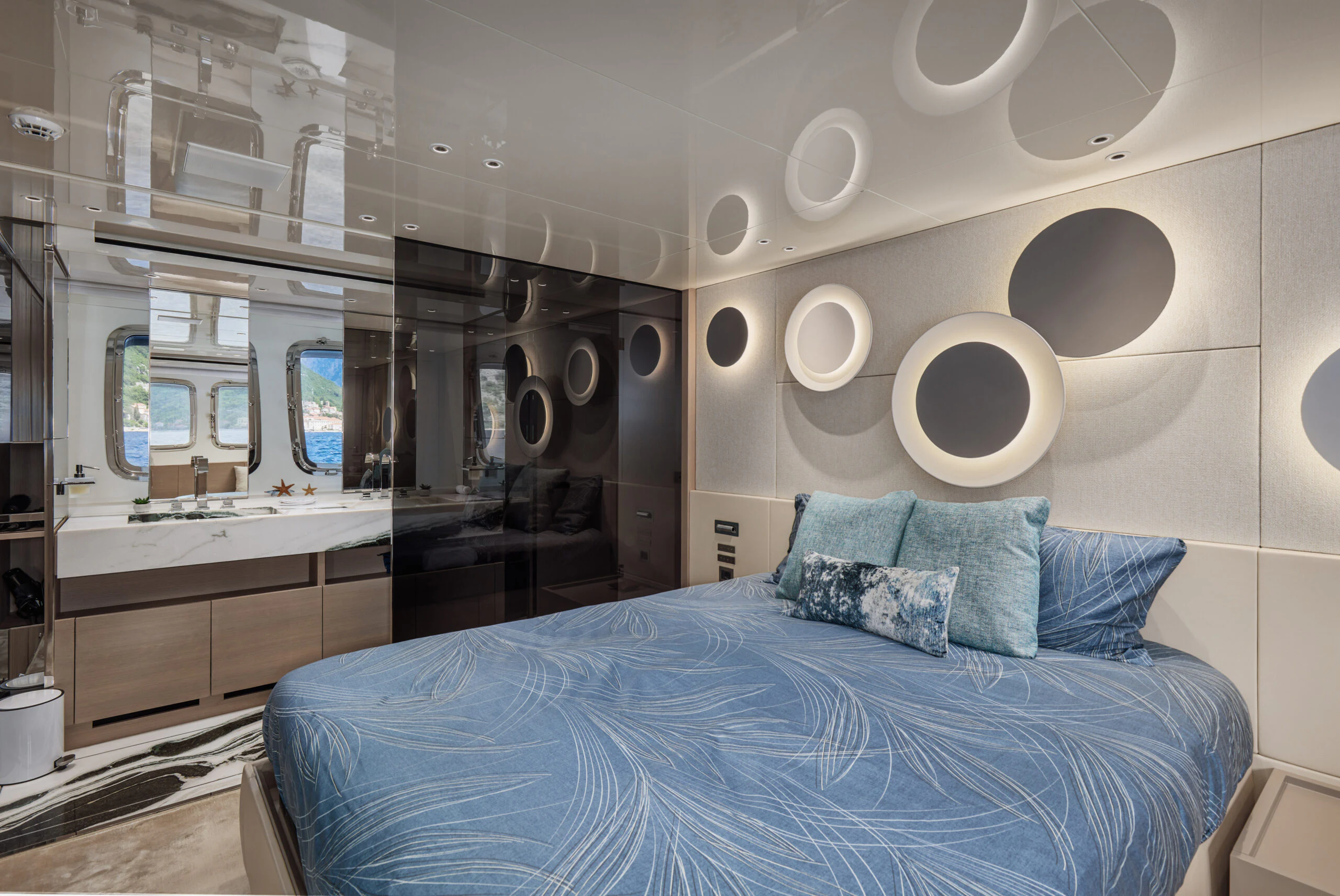 a large bed in a room aboard ZAFFIRO III Yacht for Sale
