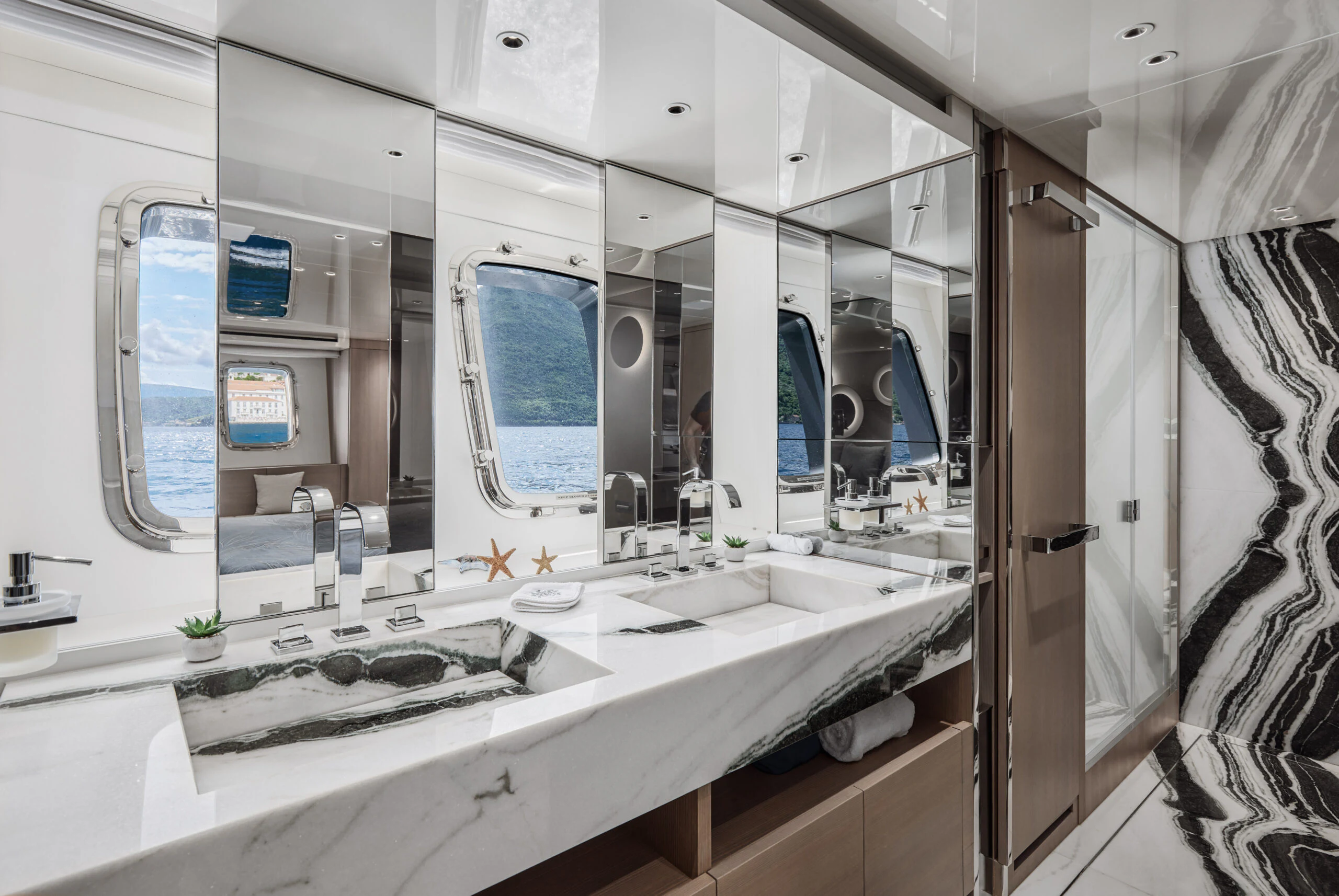 a bathroom with a large mirror aboard ZAFFIRO III Yacht for Sale