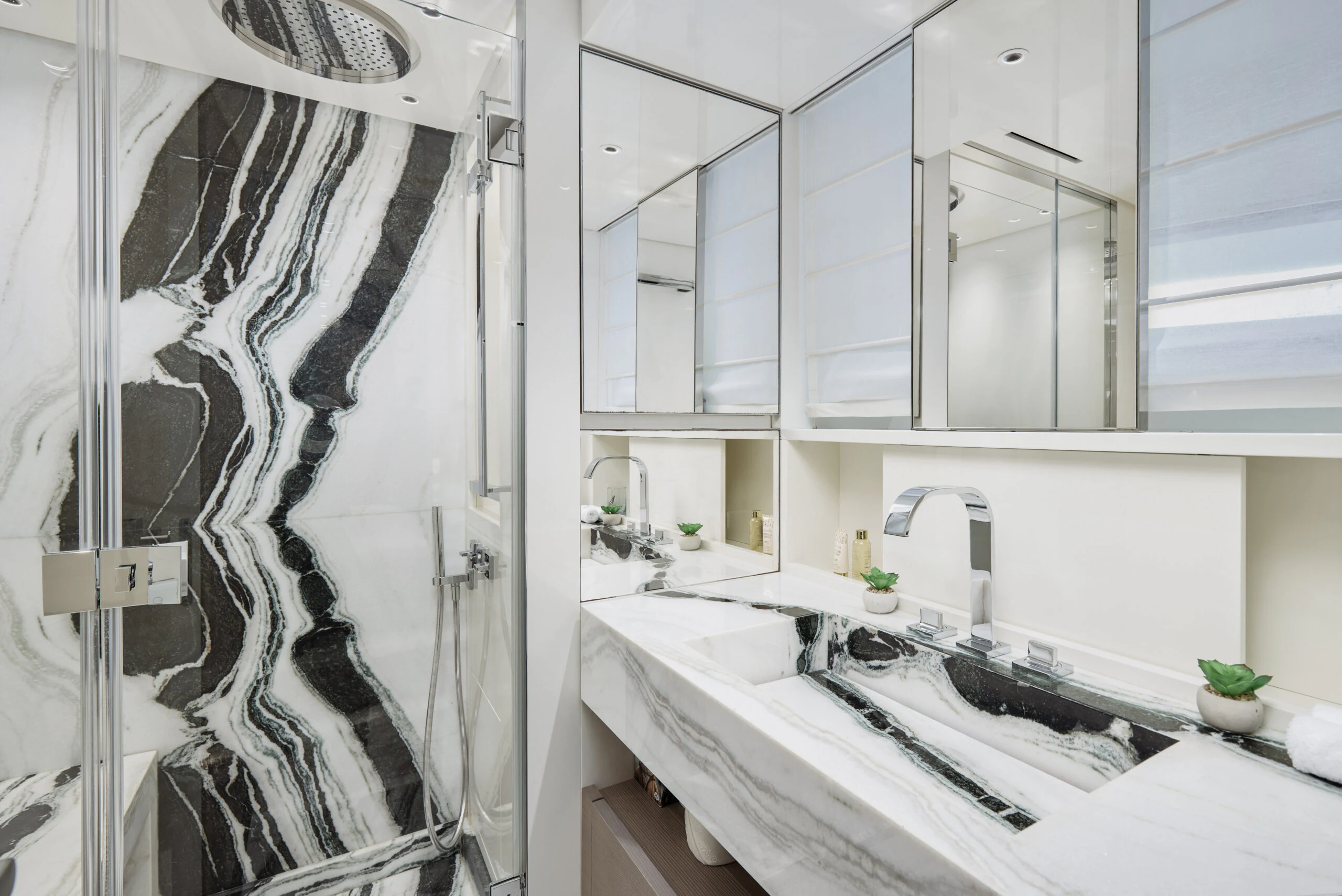 a shower curtain next to a sink aboard ZAFFIRO III Yacht for Sale