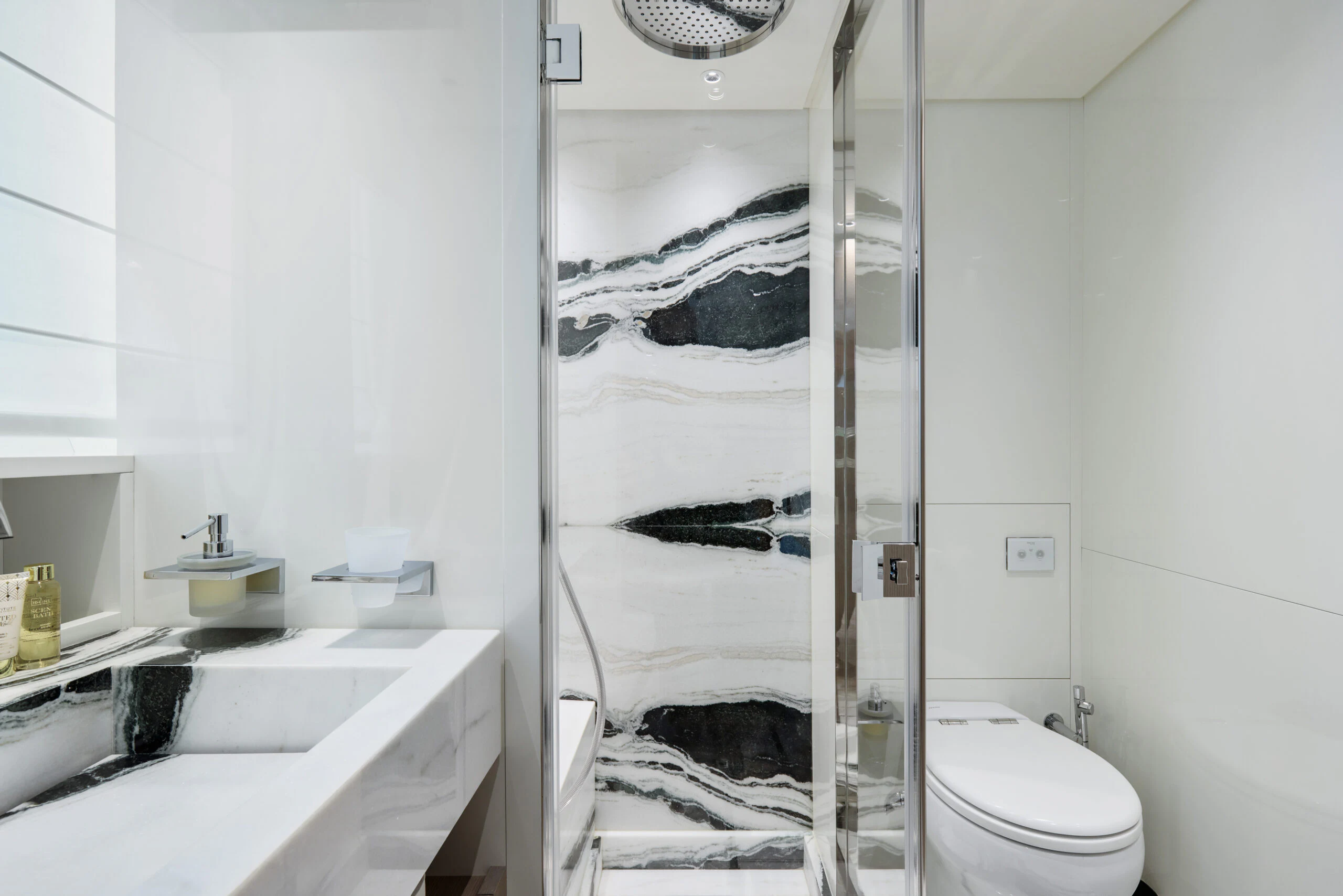 a bathroom with a shower and sink aboard ZAFFIRO III Yacht for Sale