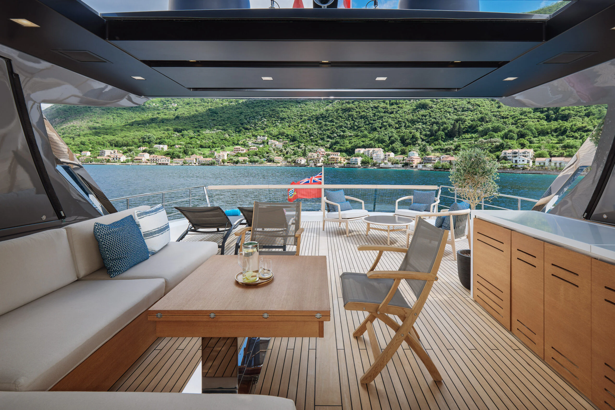 a table and chairs on a deck aboard ZAFFIRO III Yacht for Sale