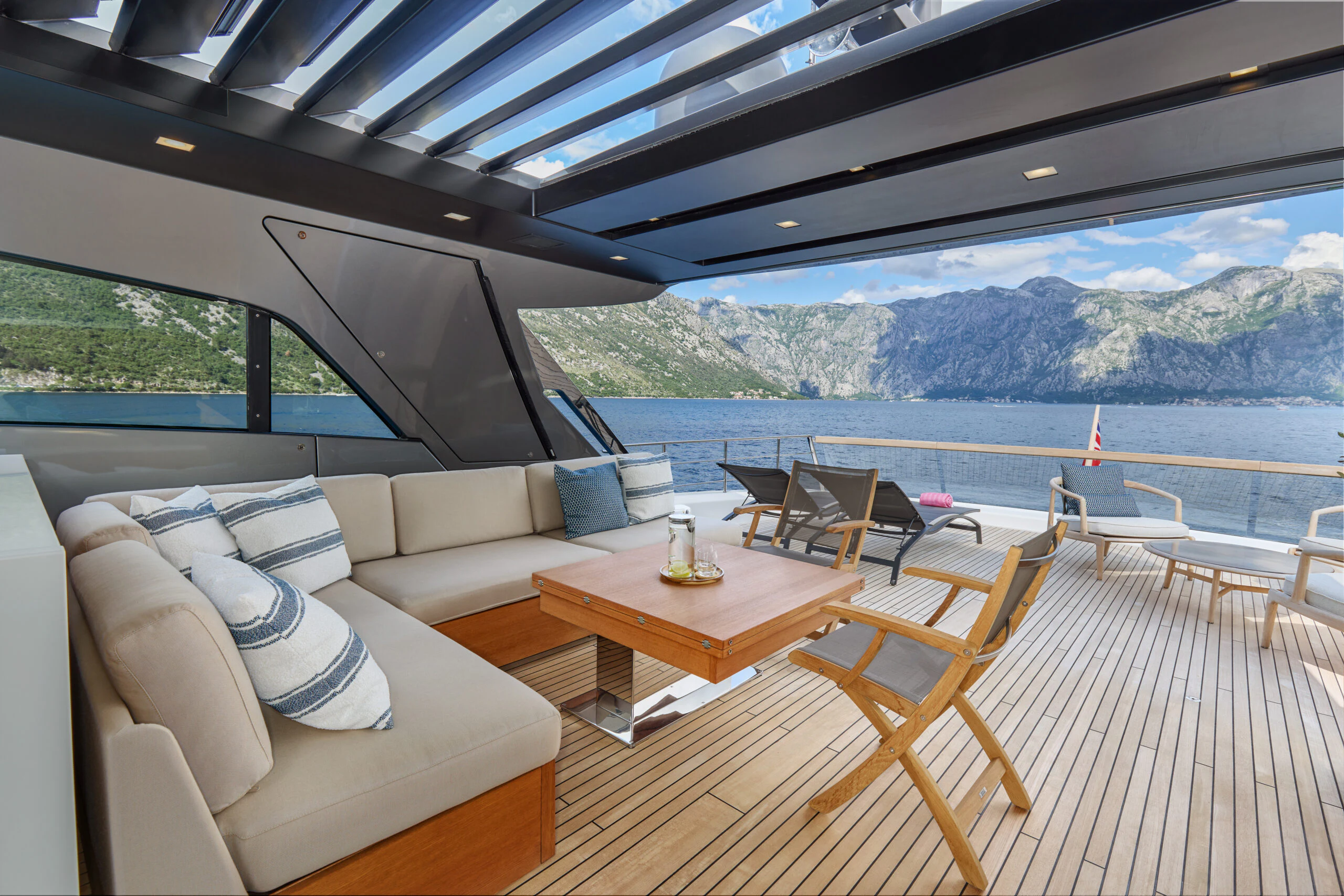 a room with a table and chairs aboard ZAFFIRO III Yacht for Sale
