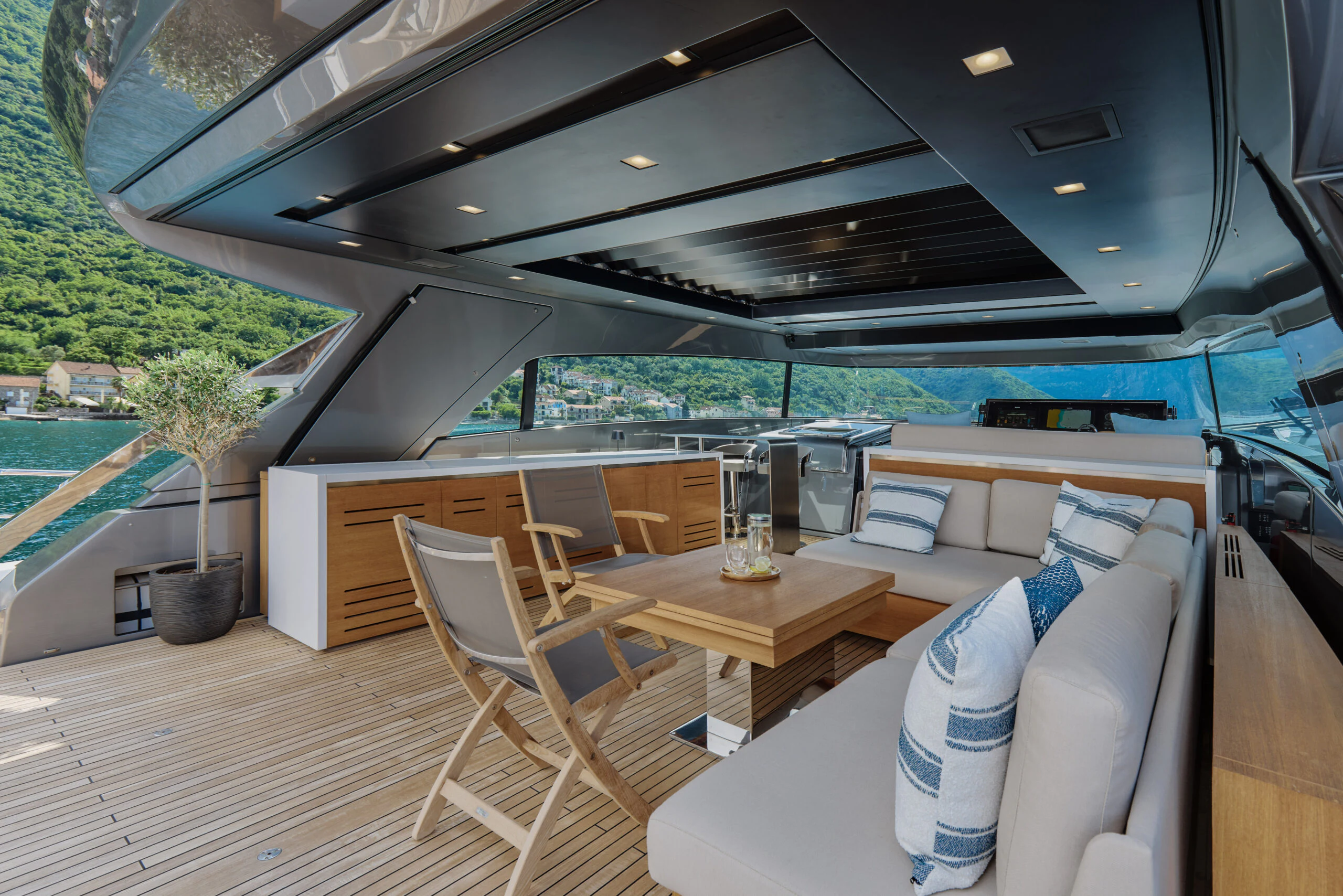a room with a table and chairs aboard ZAFFIRO III Yacht for Sale