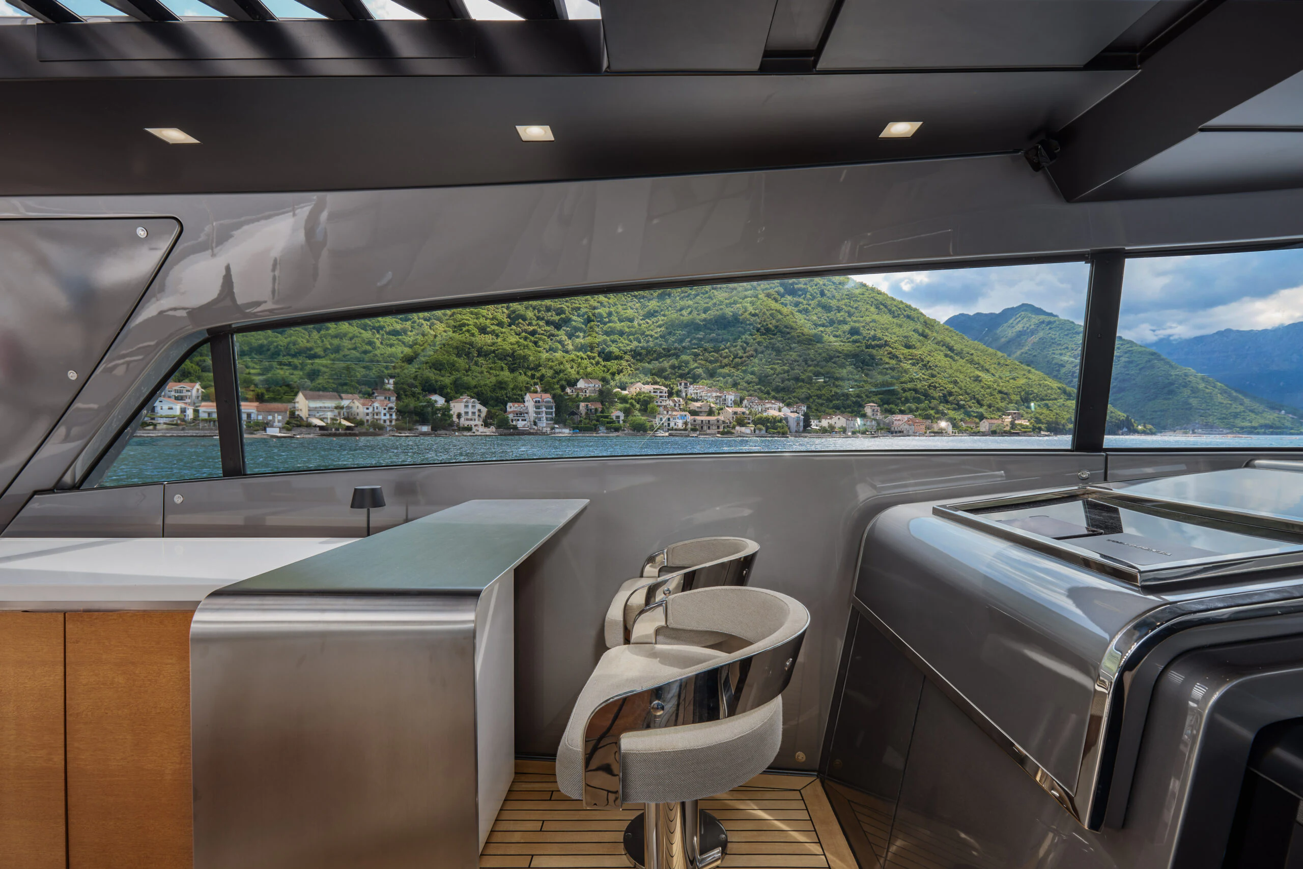 a room with a view of a city and a body of water aboard ZAFFIRO III Yacht for Sale