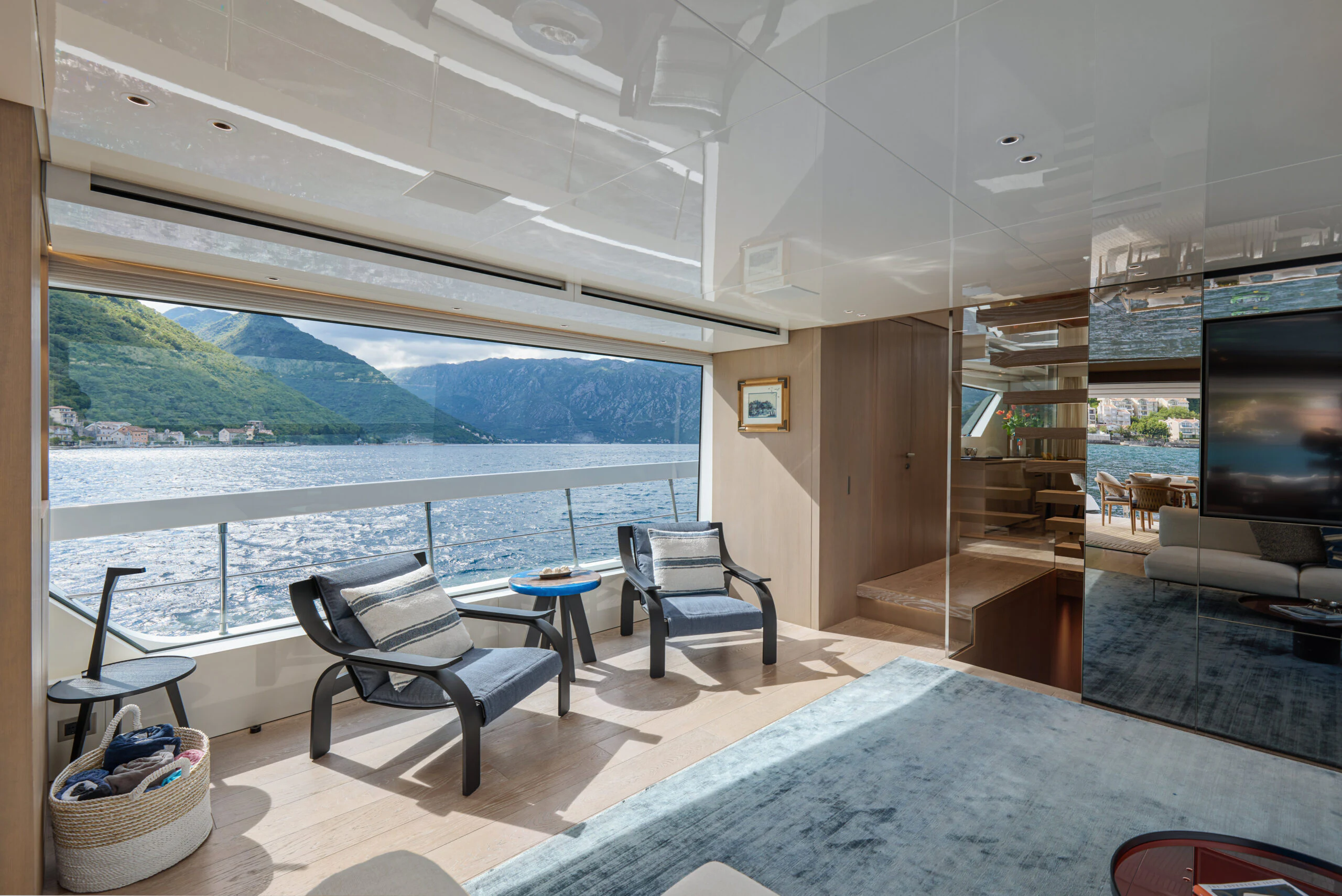 a room with a table and chairs aboard ZAFFIRO III Yacht for Sale