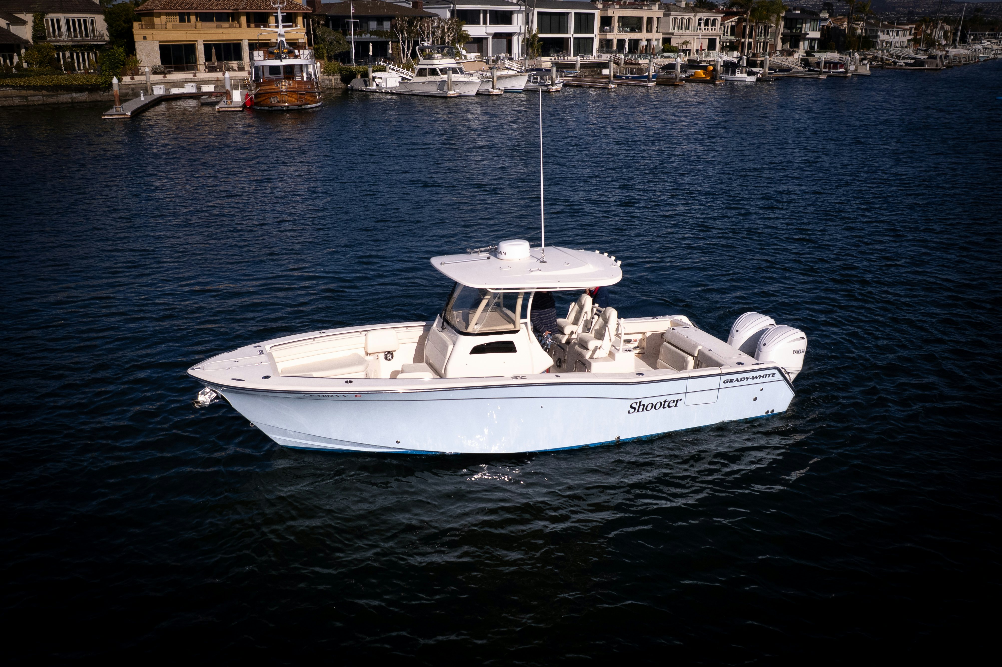a white boat in the water aboard SHOOTER Yacht for Sale