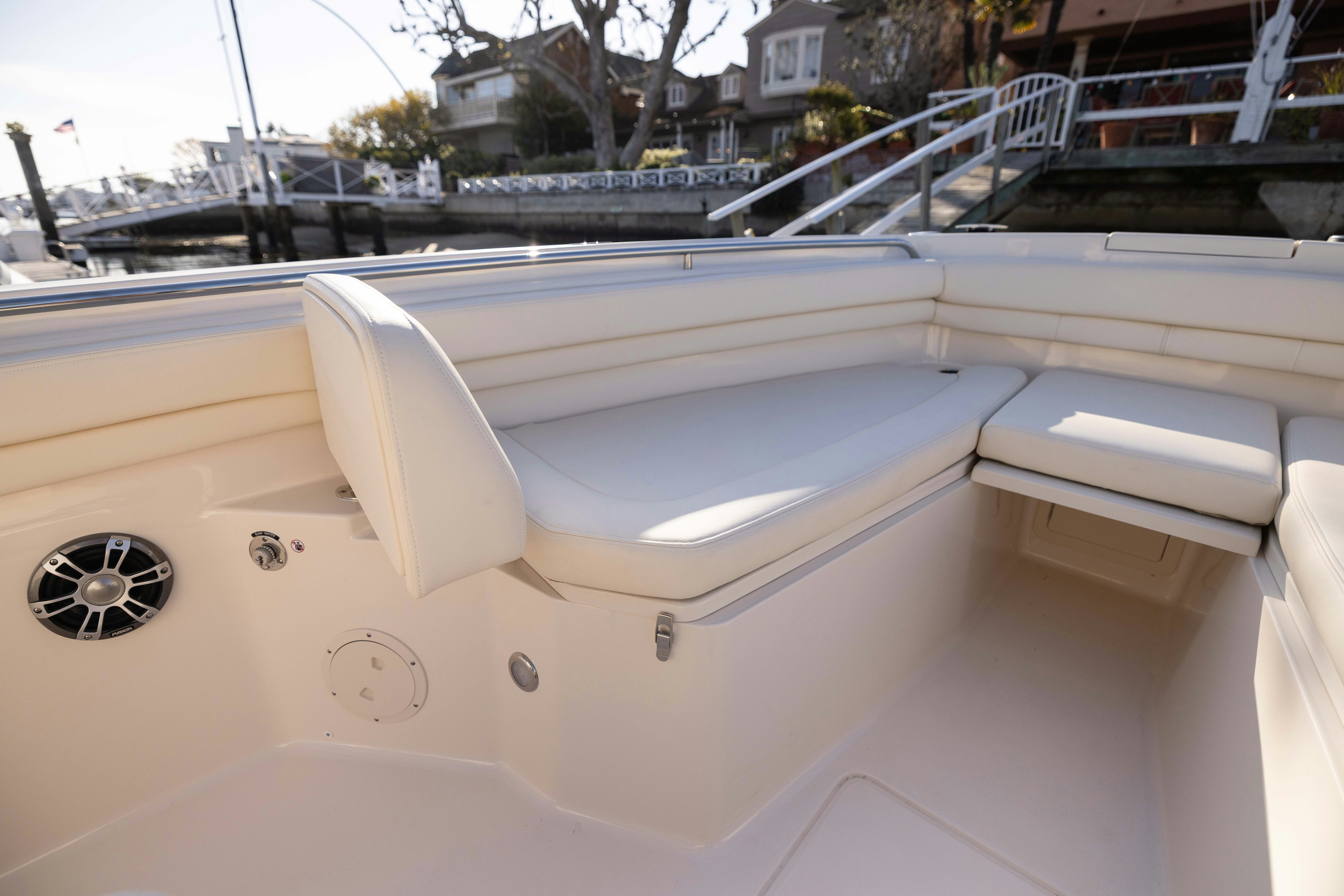 a white boat on a dock aboard SHOOTER Yacht for Sale