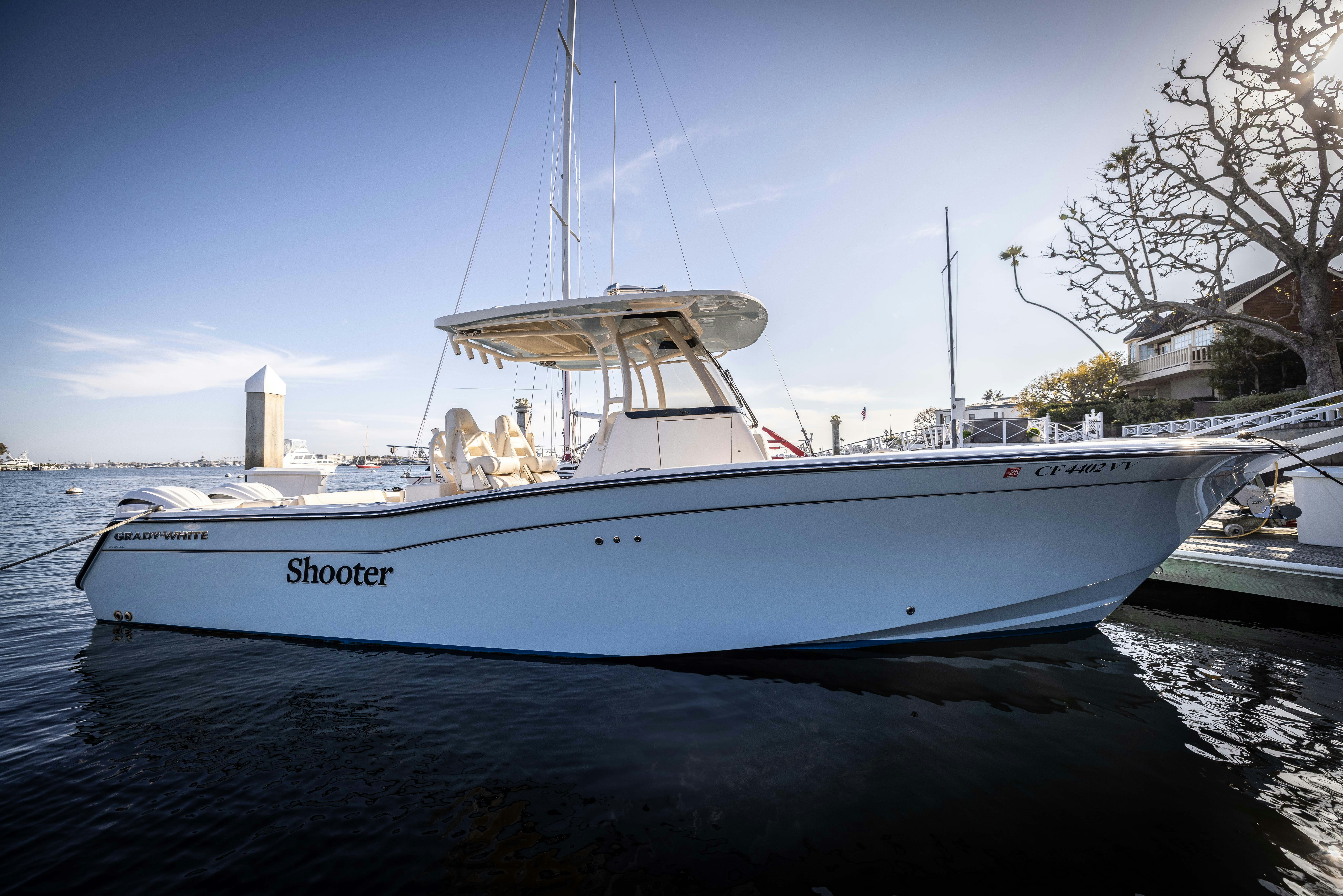 a large white boat in the water aboard SHOOTER Yacht for Sale