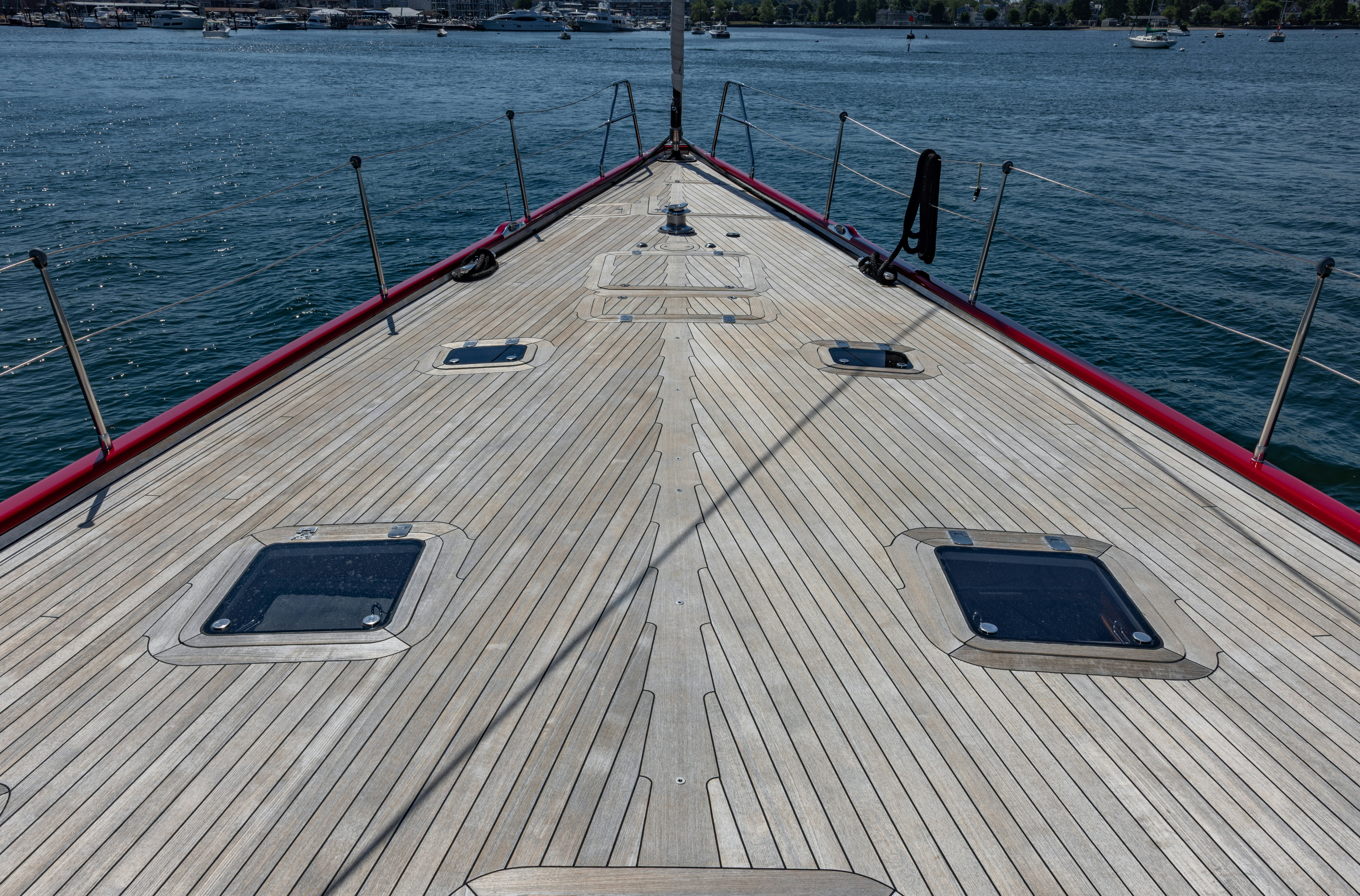 a large wooden boat on a body of water aboard RED SKY Yacht for Sale