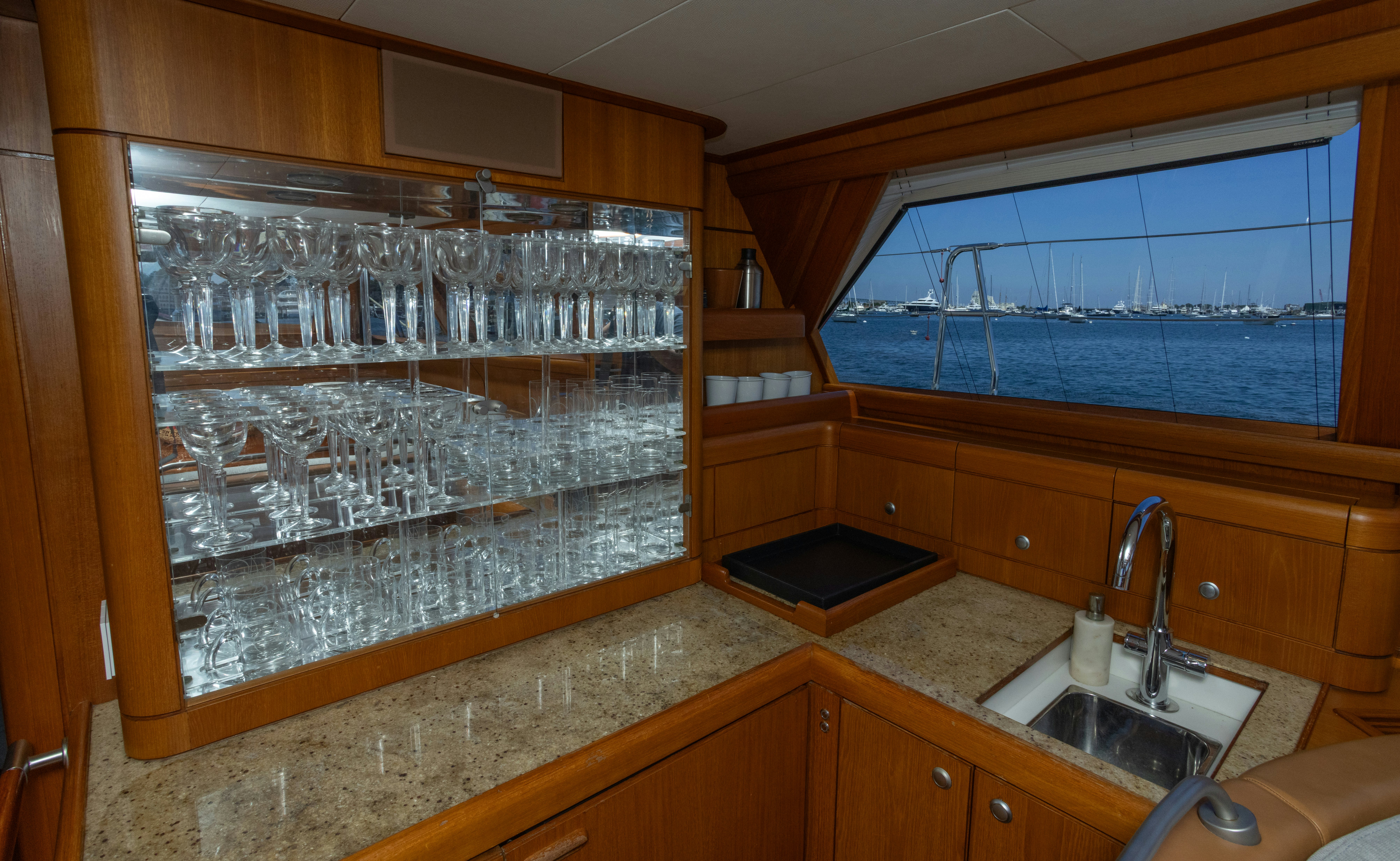 a kitchen with a countertop sink and cabinets aboard RED SKY Yacht for Sale