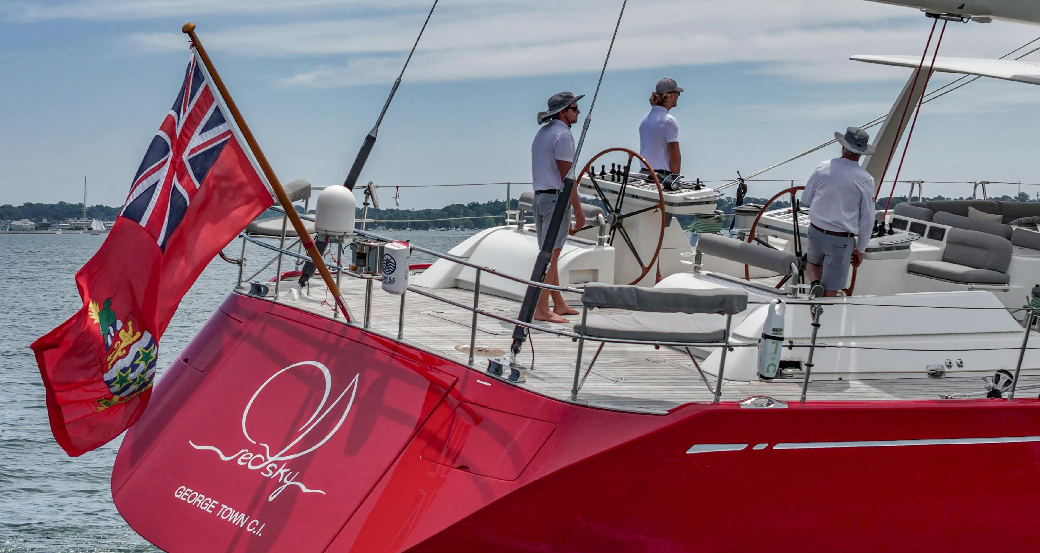 a boat with a flag on it aboard RED SKY Yacht for Sale