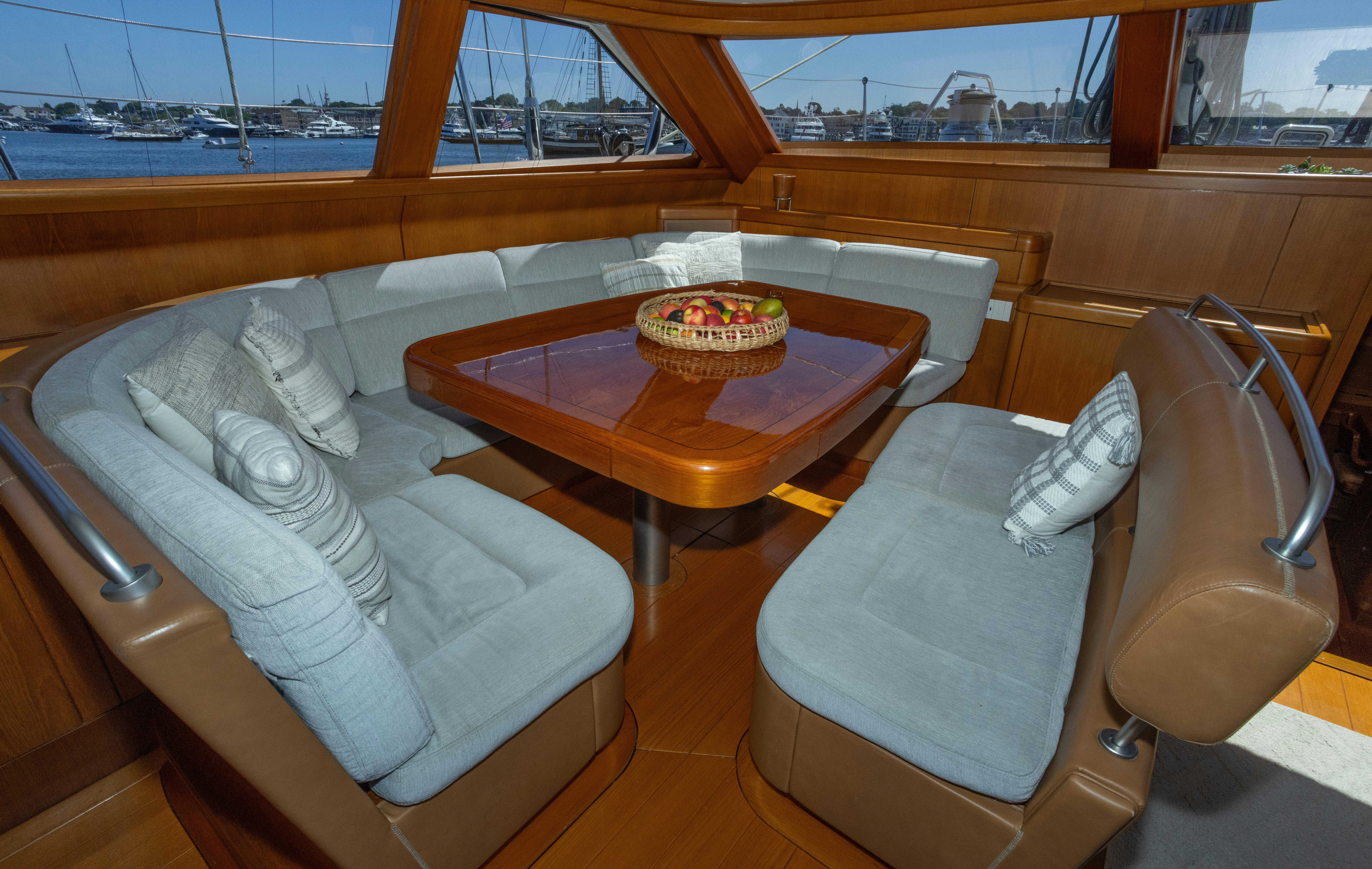 a room with a table and chairs aboard RED SKY Yacht for Sale