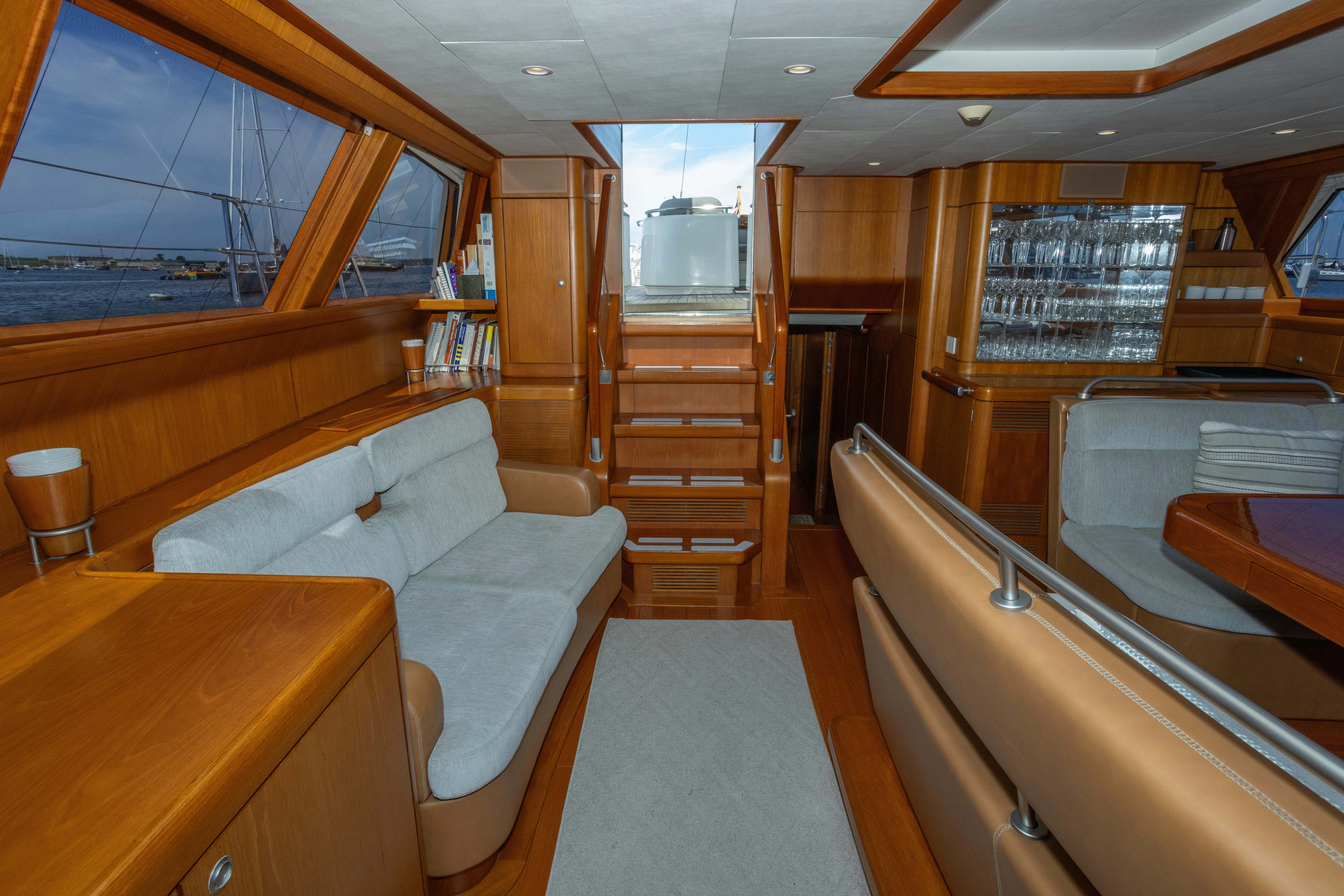 a boat with a bed and a table aboard RED SKY Yacht for Sale