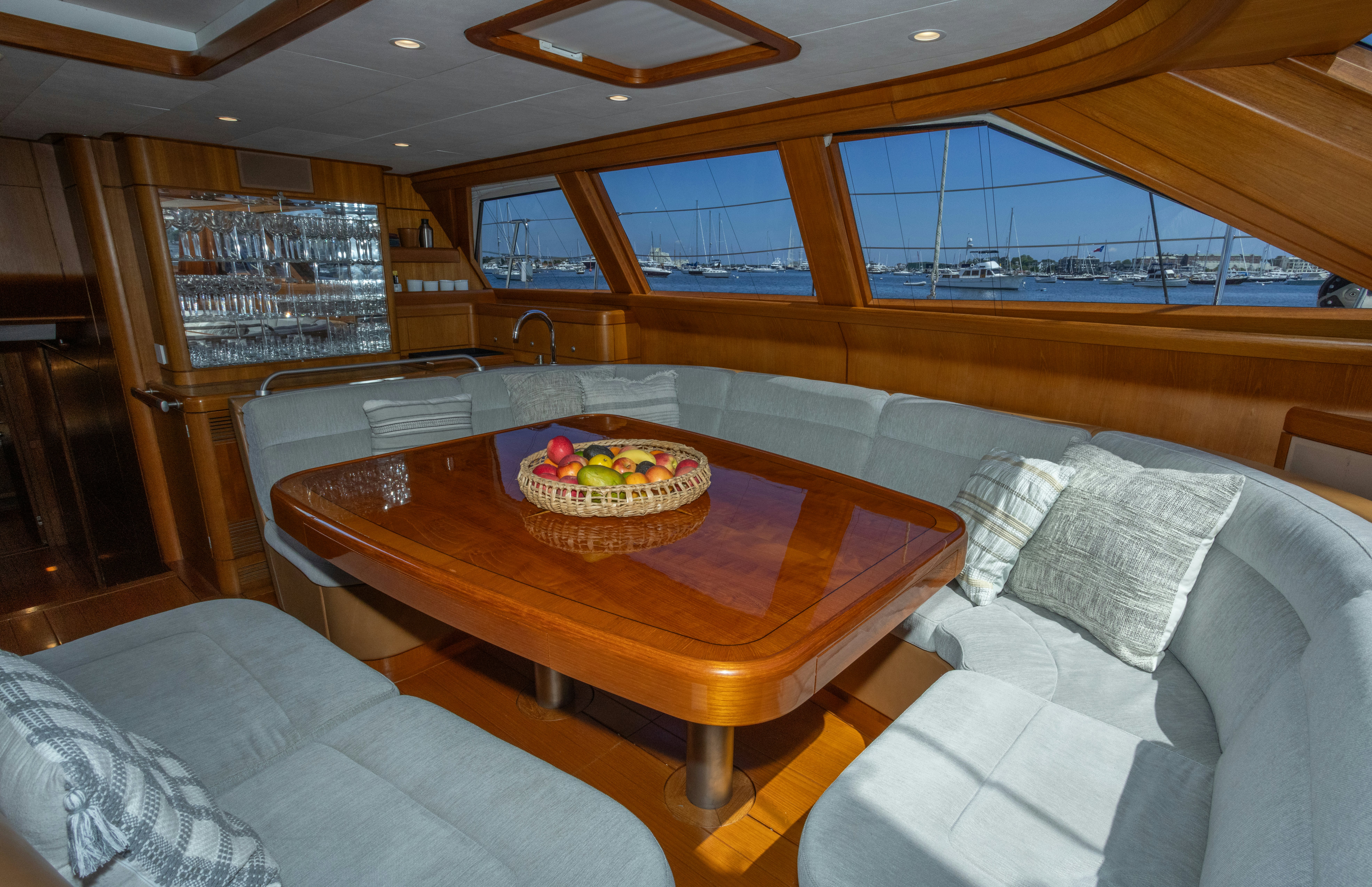 a room with a table and couch aboard RED SKY Yacht for Sale