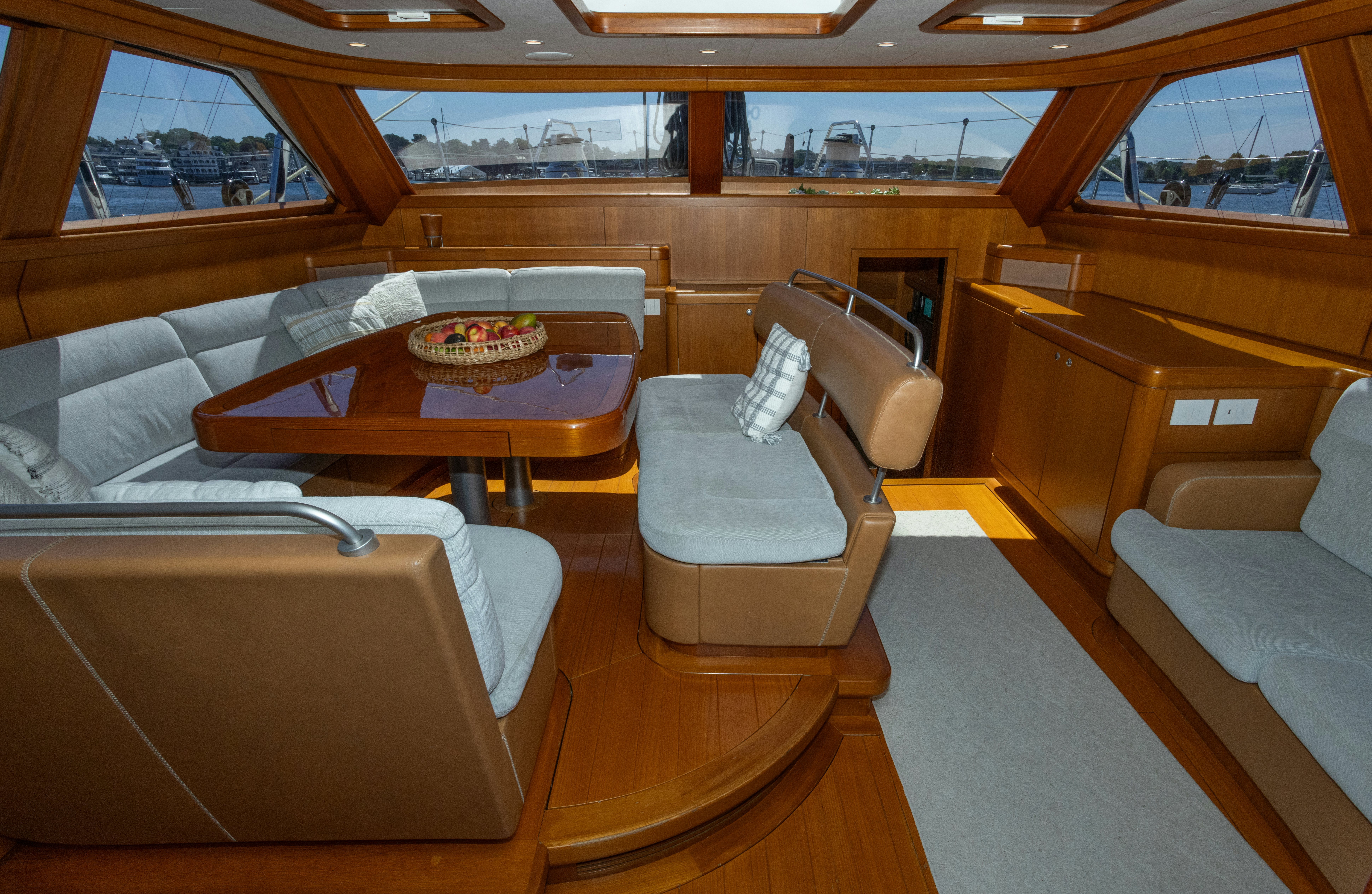 a room with a table and chairs aboard RED SKY Yacht for Sale