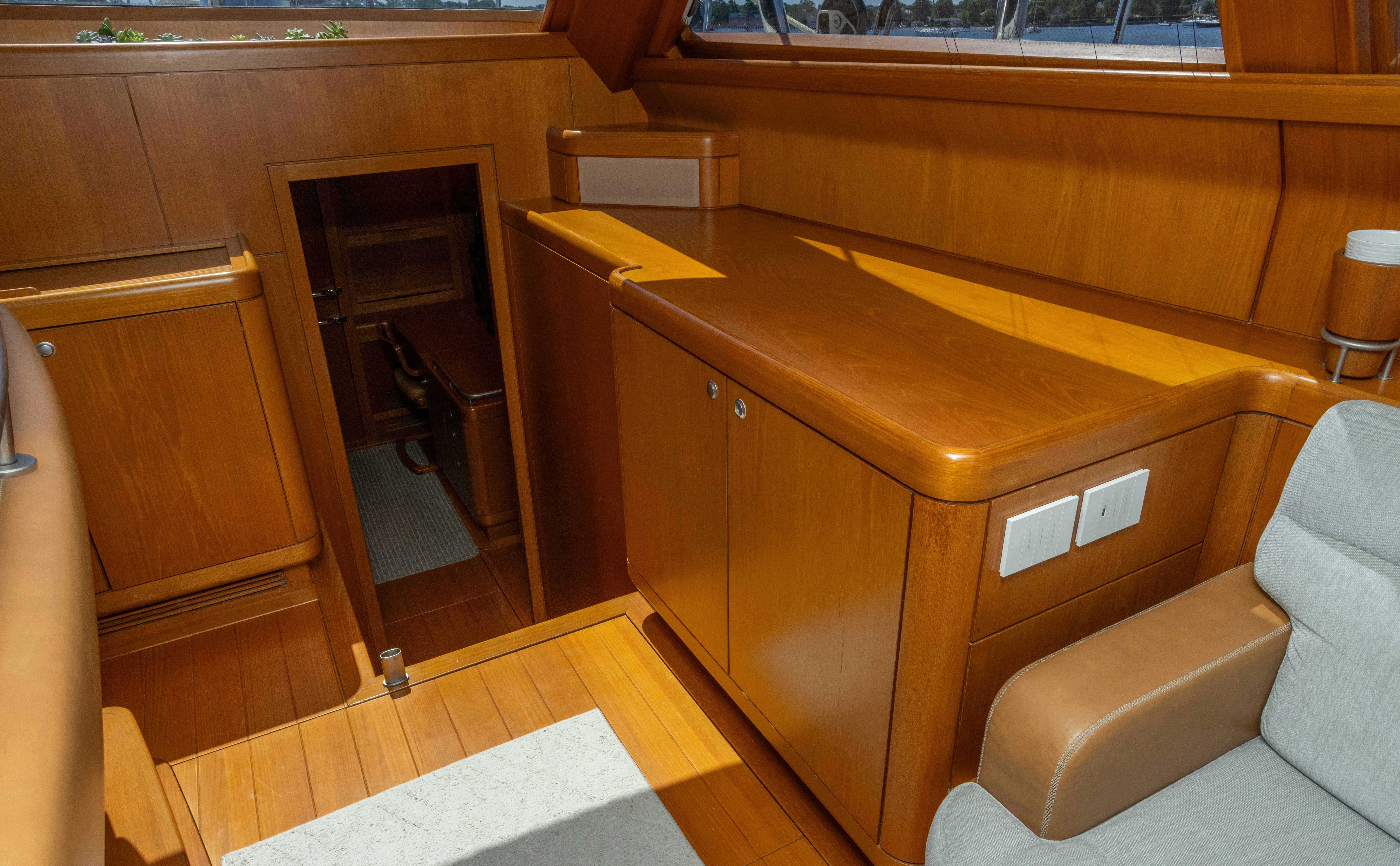 a room with a couch and a desk aboard RED SKY Yacht for Sale