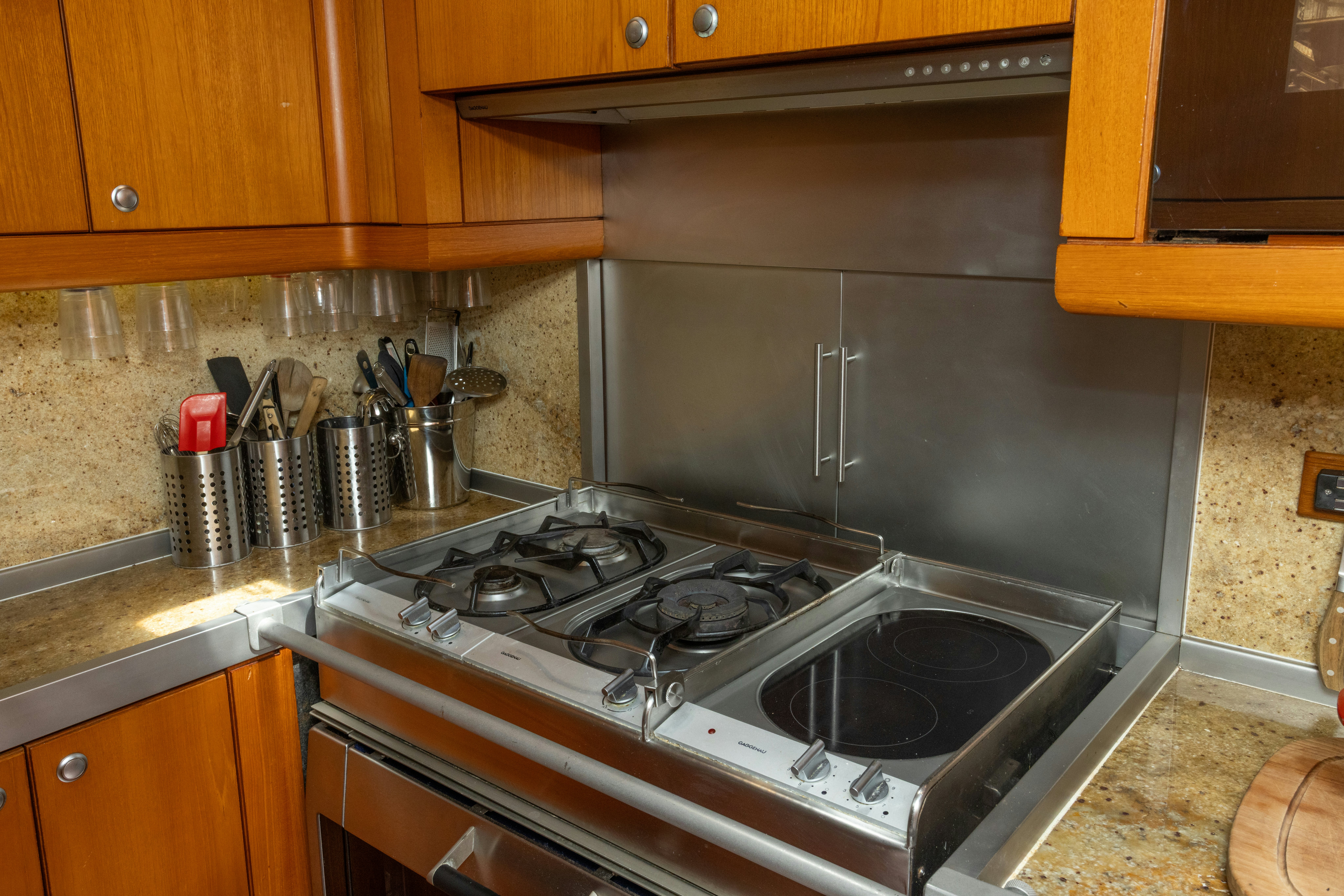 a kitchen with a stove and cabinets aboard RED SKY Yacht for Sale