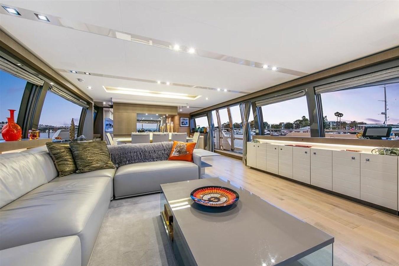 a living room with a couch and a table aboard LONTANO Yacht for Sale