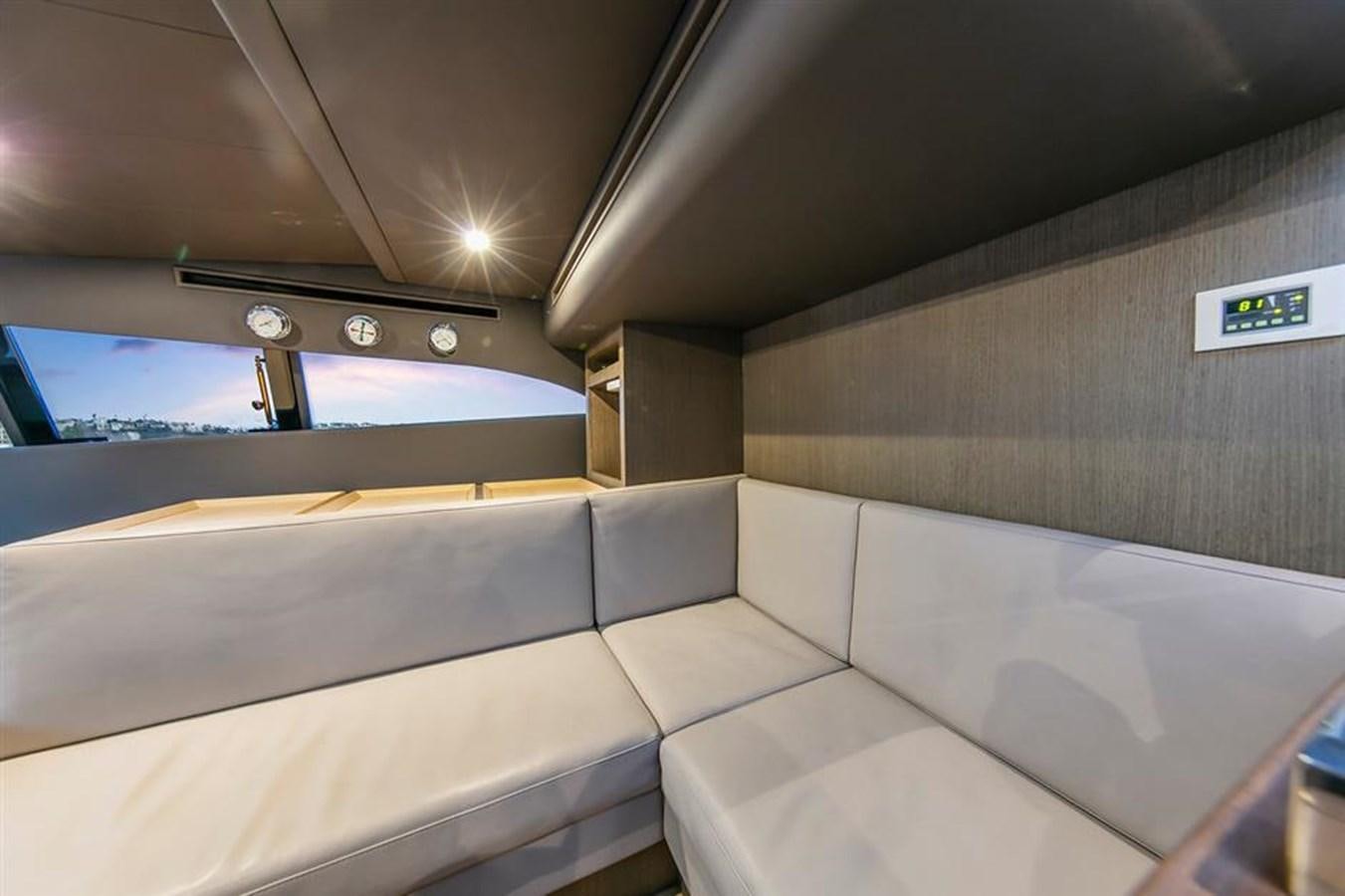 a room with a large window aboard LONTANO Yacht for Sale