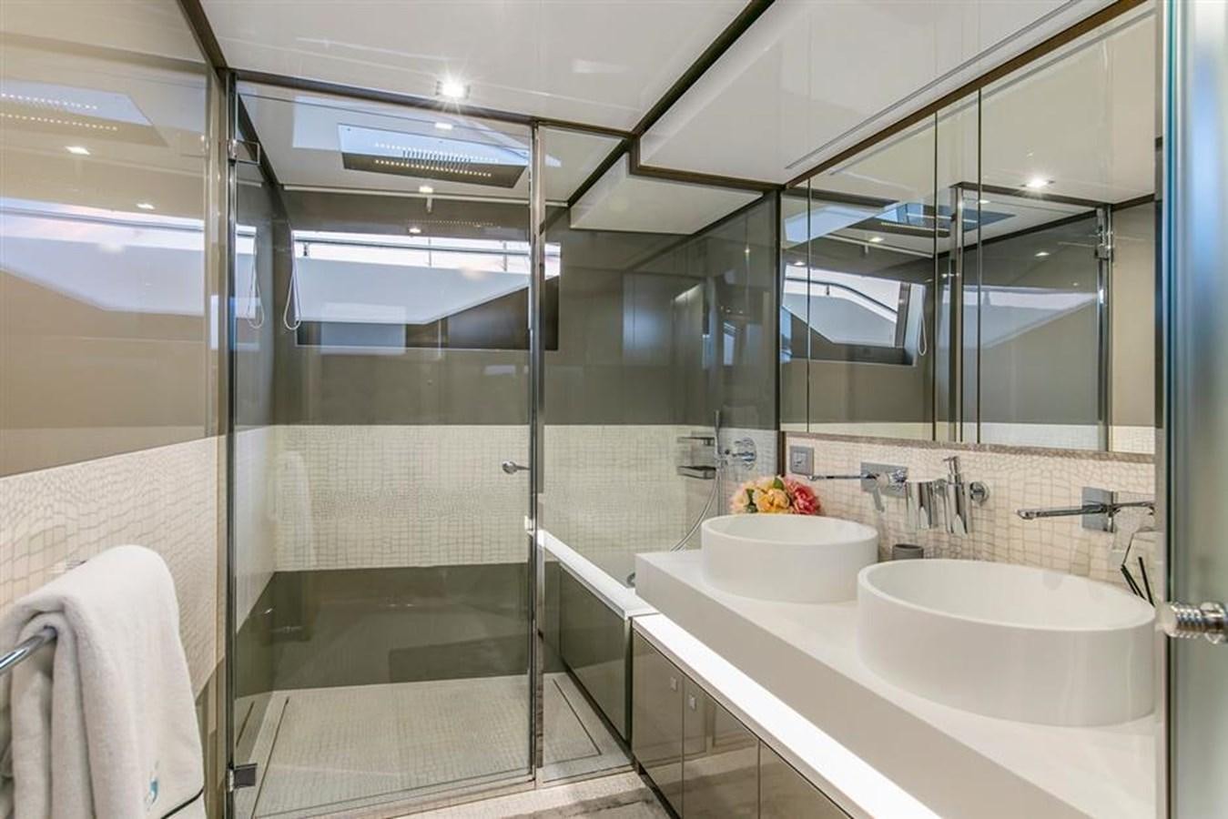 a bathroom with a glass shower aboard LONTANO Yacht for Sale