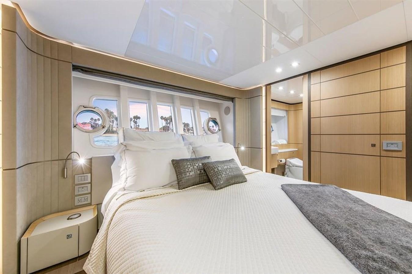 a room with two beds aboard LONTANO Yacht for Sale