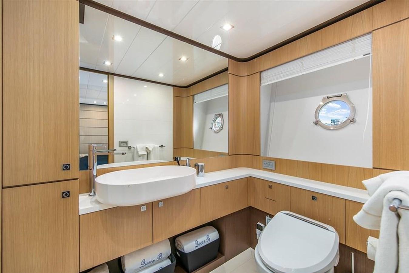 a bathroom with a sink and toilet aboard LONTANO Yacht for Sale