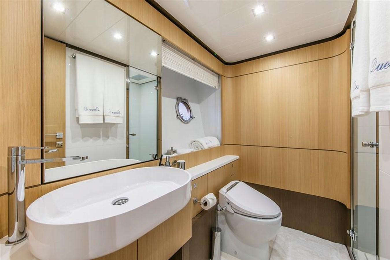 a bathroom with a large mirror aboard LONTANO Yacht for Sale
