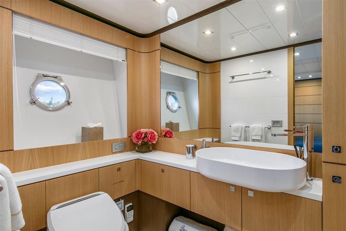 a bathroom with a large mirror aboard LONTANO Yacht for Sale